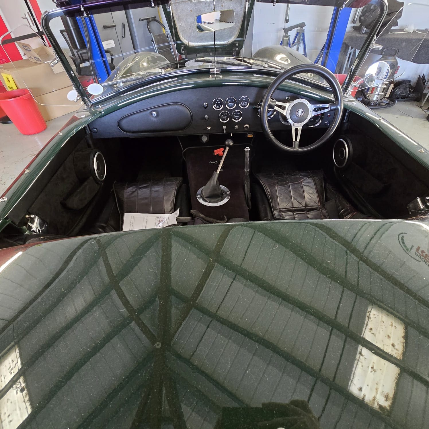 Alpine KT-450 amp tucked under seat in DAX Cobra
