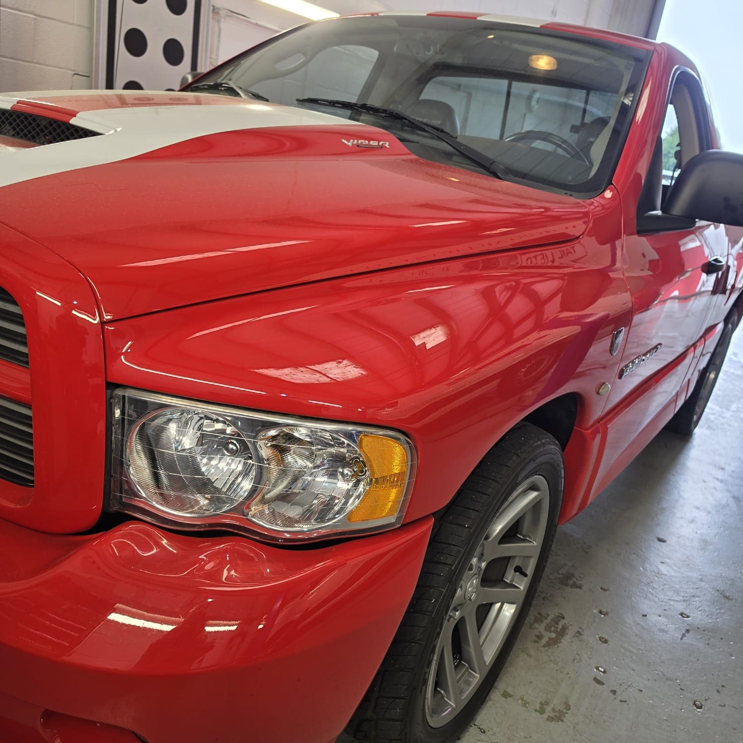 Red Dodge Ram with replacement stereo installed after original unit failure