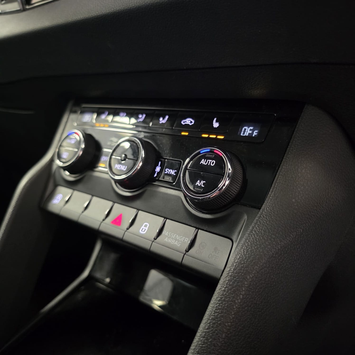 Skoda Karoq heated seat retrofit showing integrated climate and BCM upgrade project