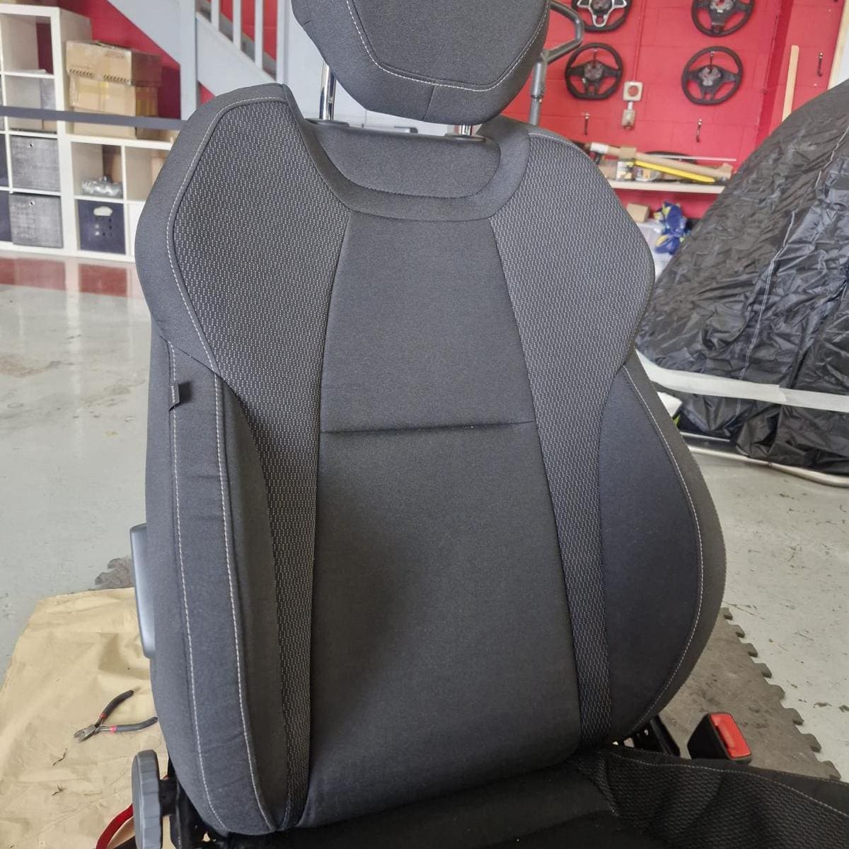 Seat stripped for genuine OEM heated seat element installation in a Skoda Karoq