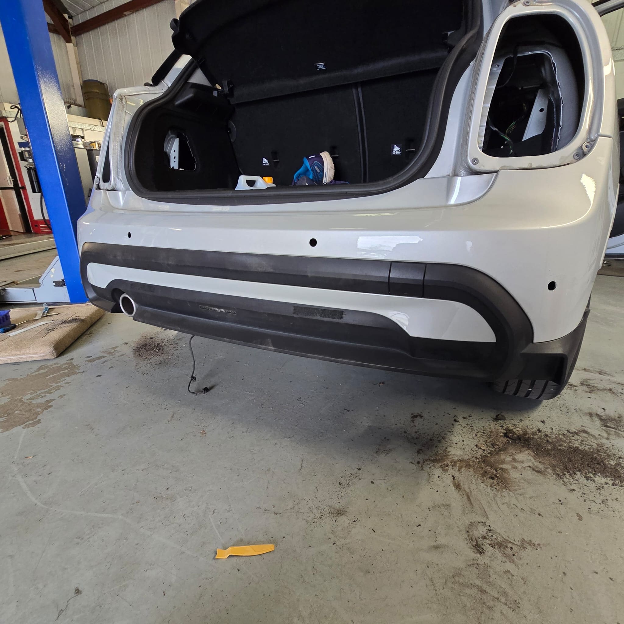 Close-up of flush-fit parking sensors on the Mini Cooper rear bumper