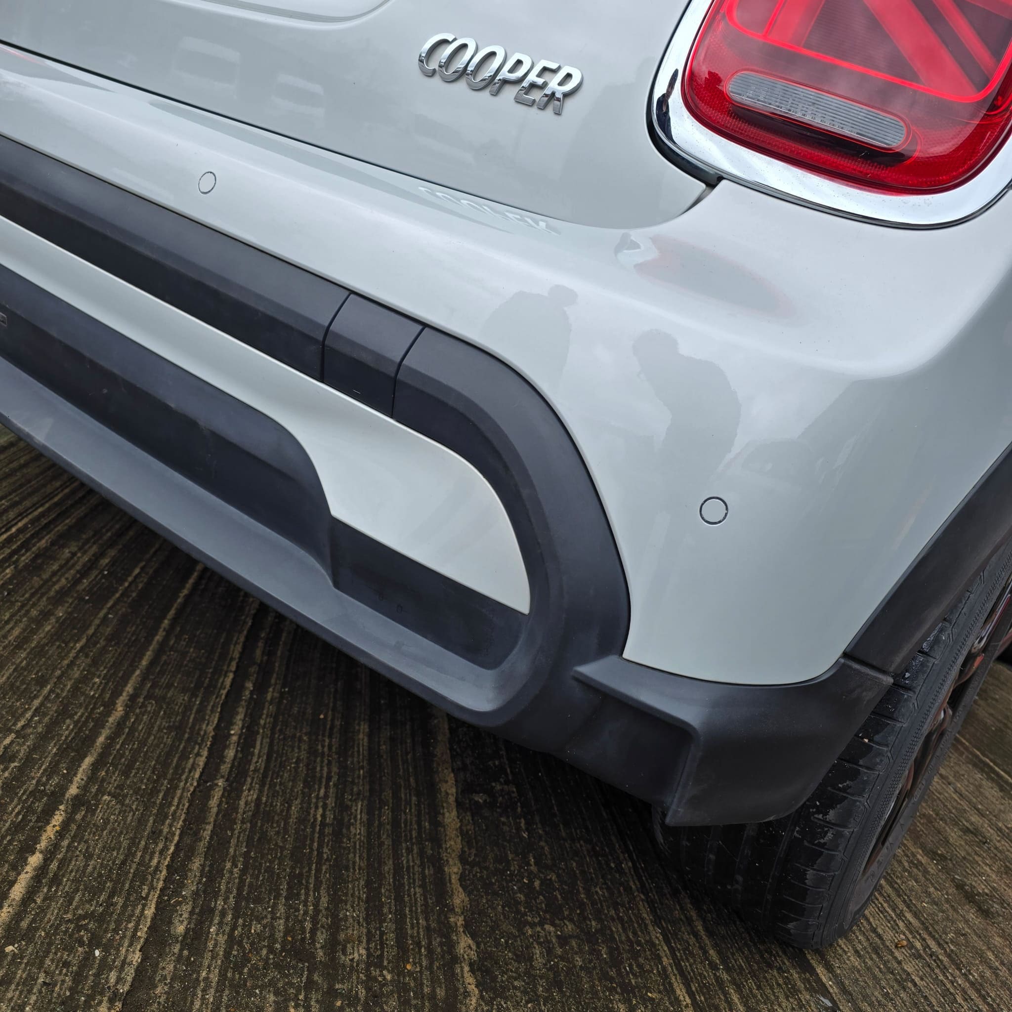 Completed Mini Cooper parking sensor retrofit with factory-style audible alert setup