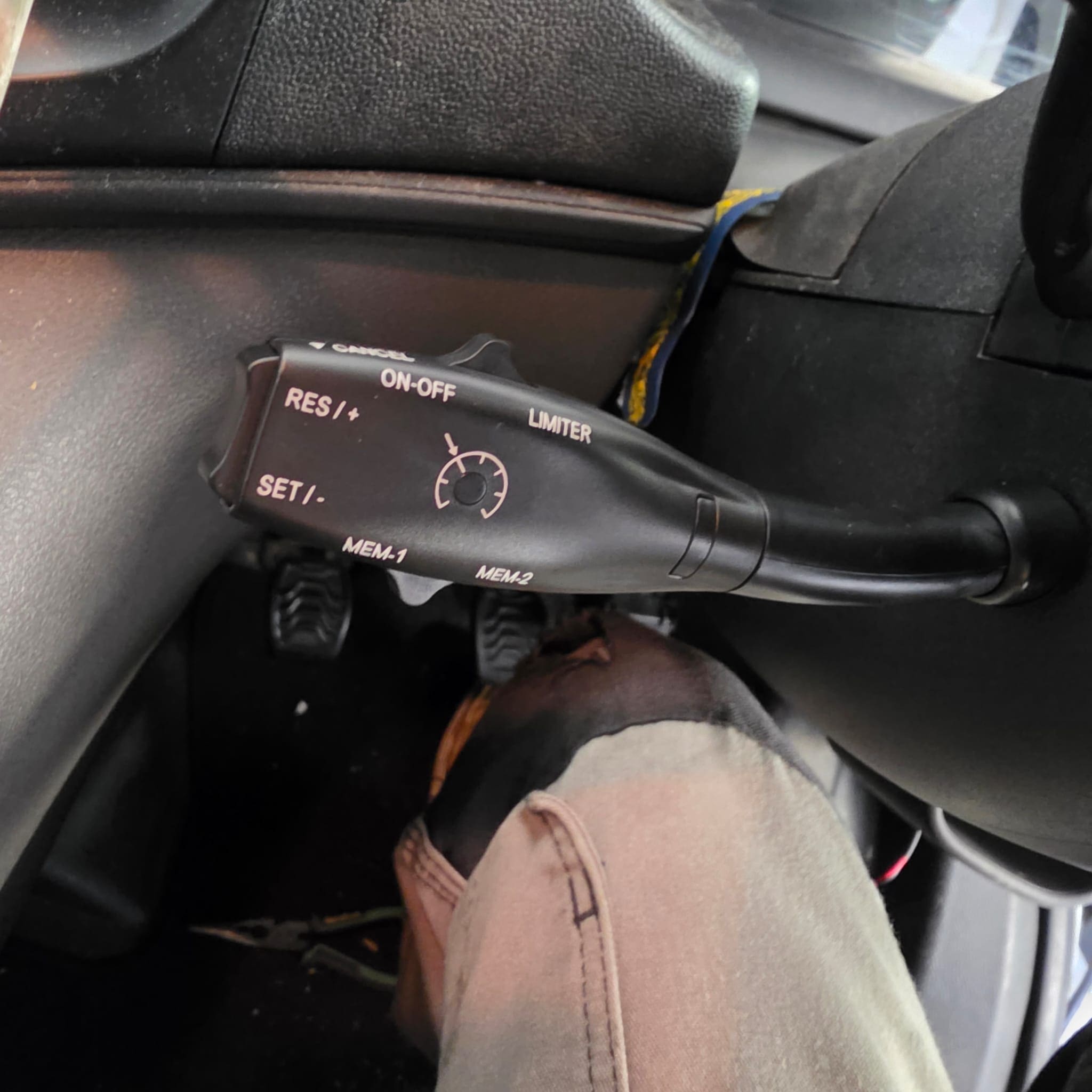 Ford Transit steering column area showing the added cruise control stalk retrofit