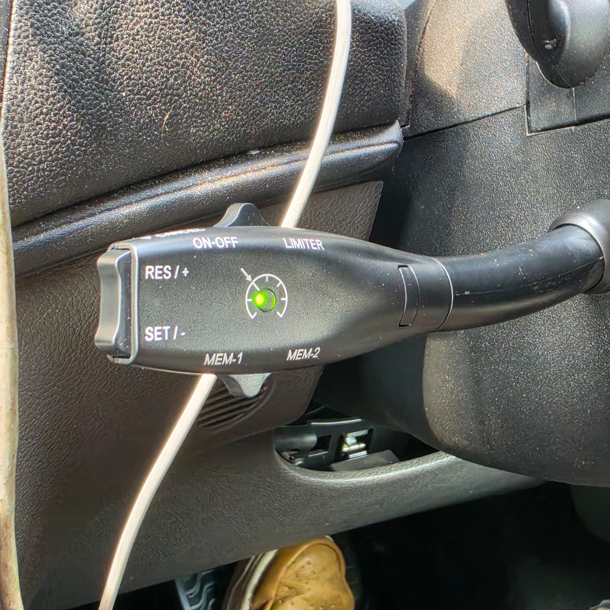 Close view of the third stalk fitted to the steering column for Ford Transit cruise control operation