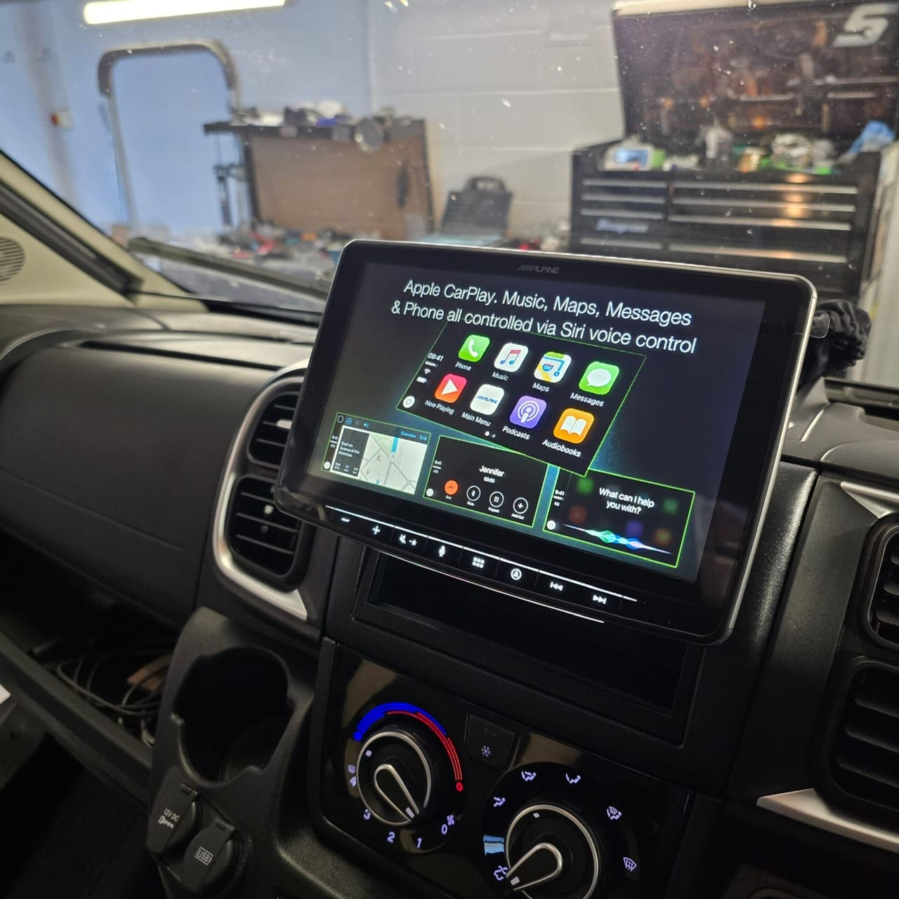 Workshop view of the Ducato motorhome during stereo upgrade with trims removed for access
