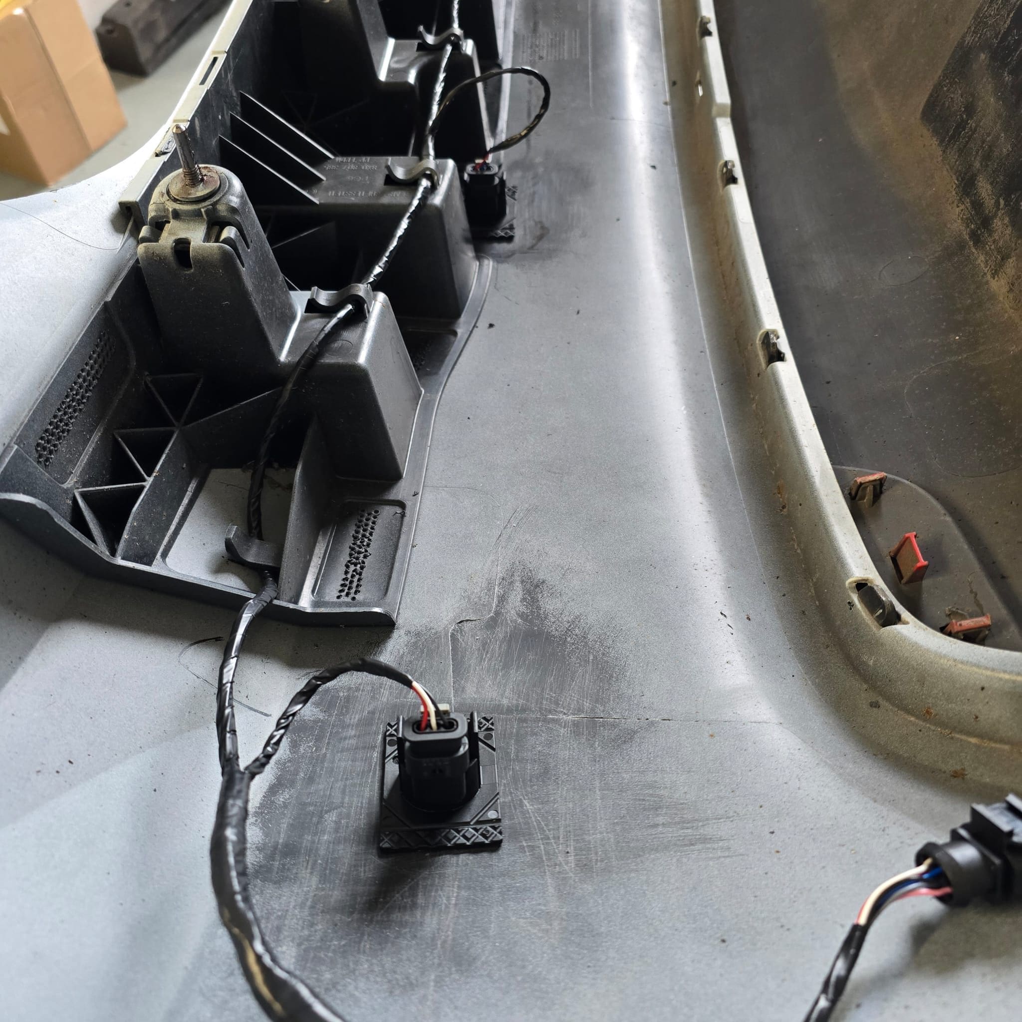 Audi A1 parking sensor control module fitted with CAN bus wiring connected and secured