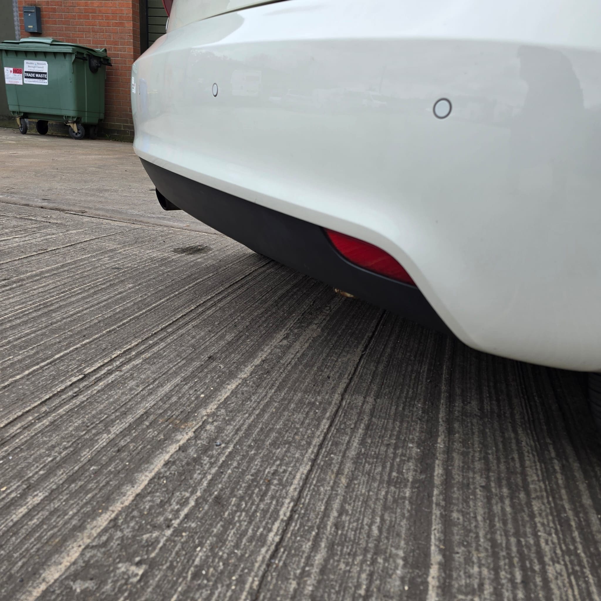 Audi A1 retrofit wiring route and installation work completed with bumper removed for access