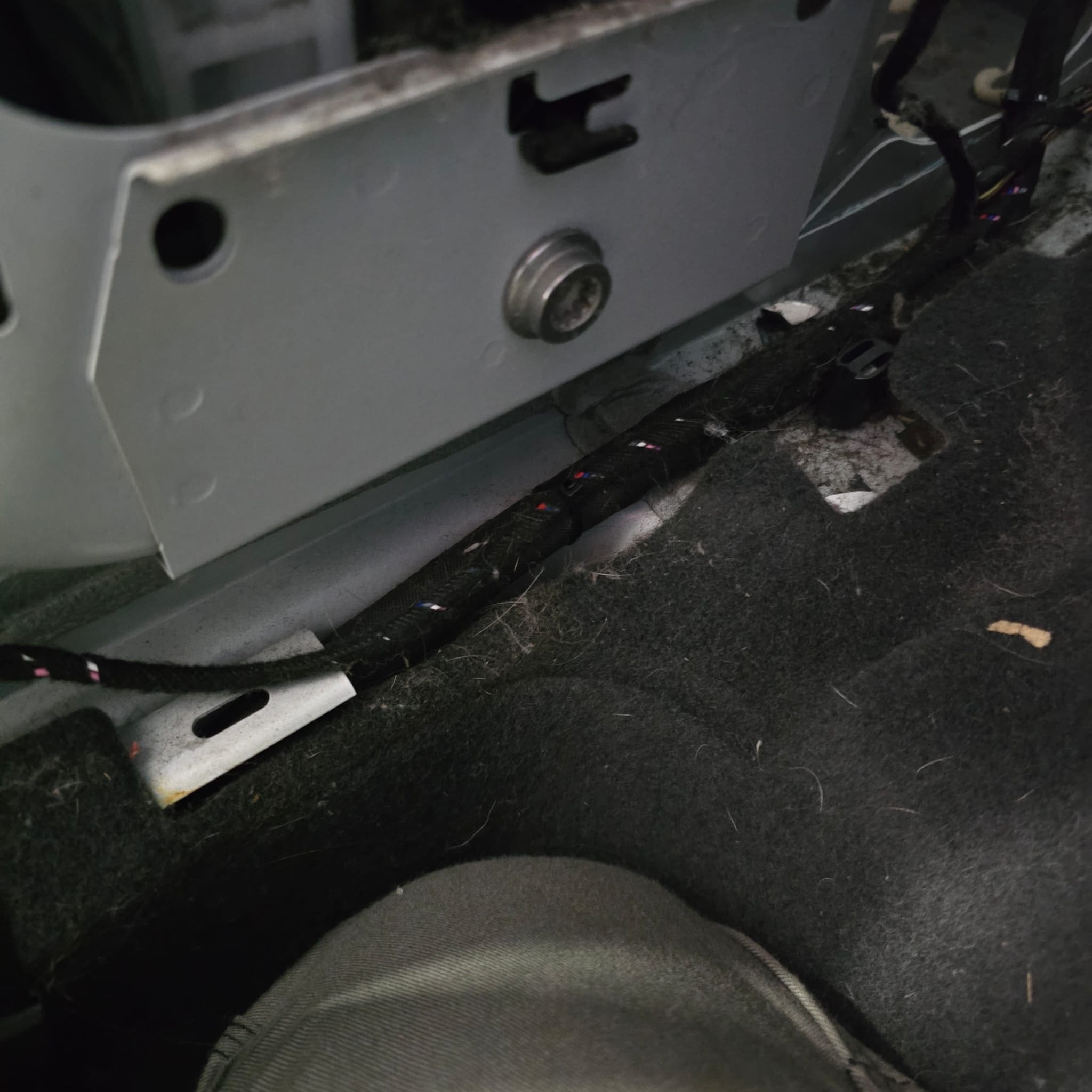 Audi A1 retrofit wiring routed forward on the driver side and secured