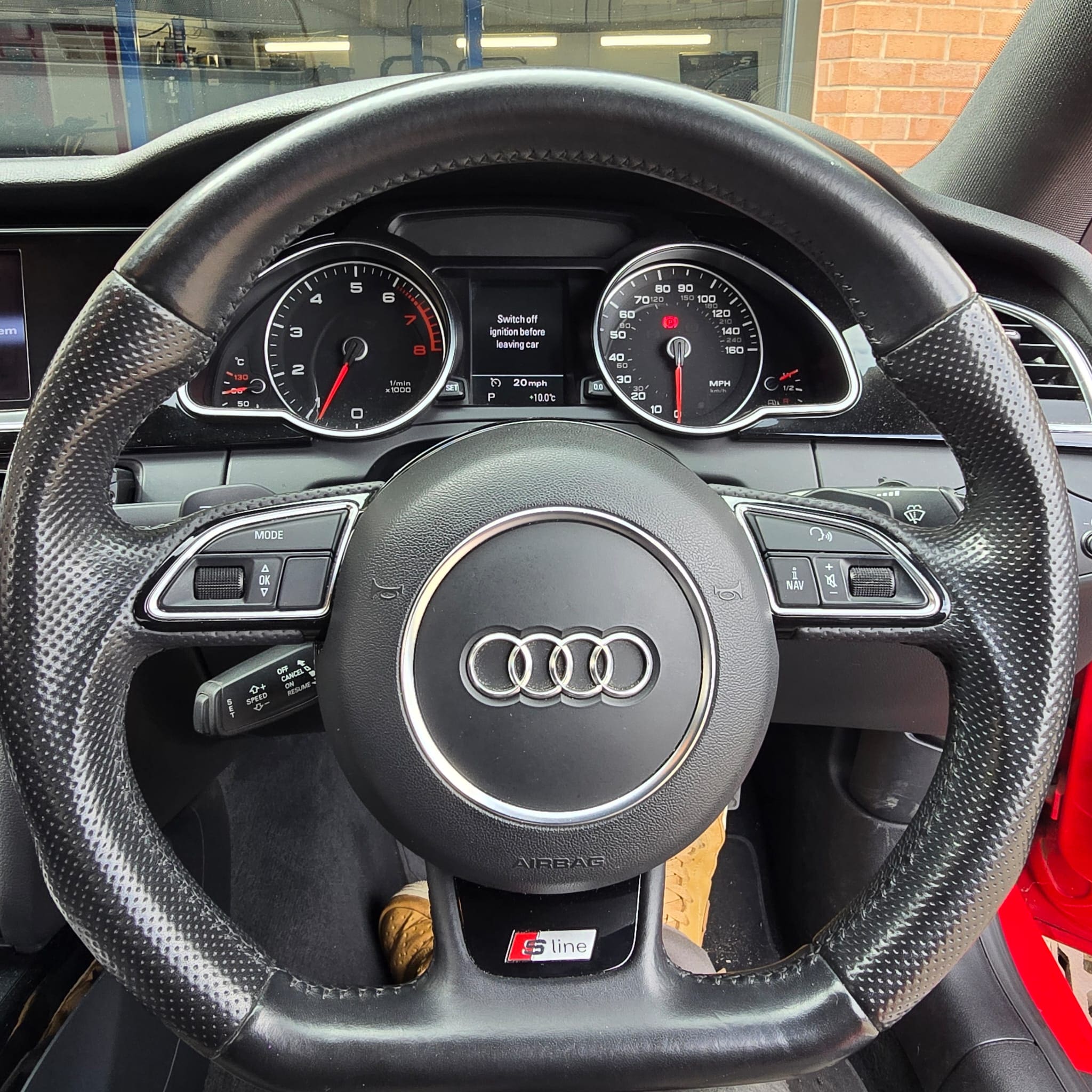 Audi A5 interior showing factory-style cruise control retrofit completed and ready to use