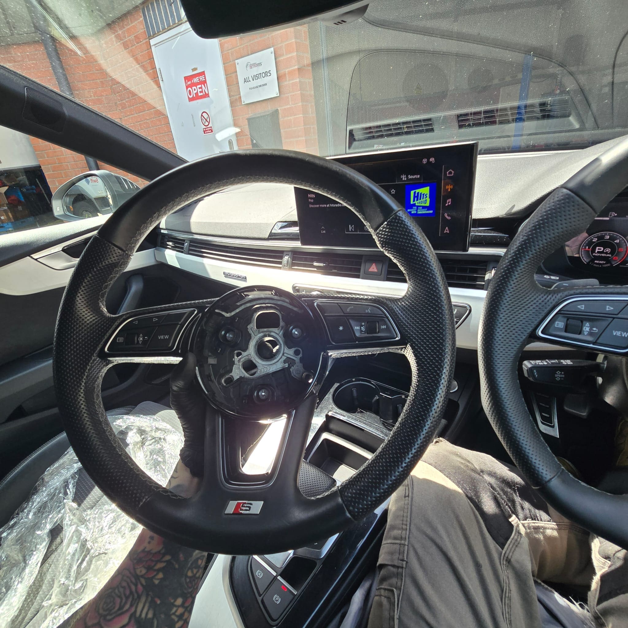 Close-up of the flat bottom steering wheel shape in the Audi A5 interior