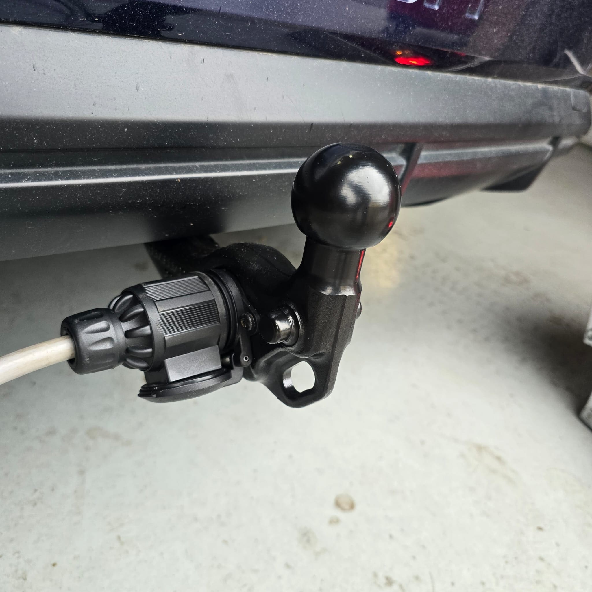 Rear section of Audi Q4 showing completed retractable towbar retrofit installation