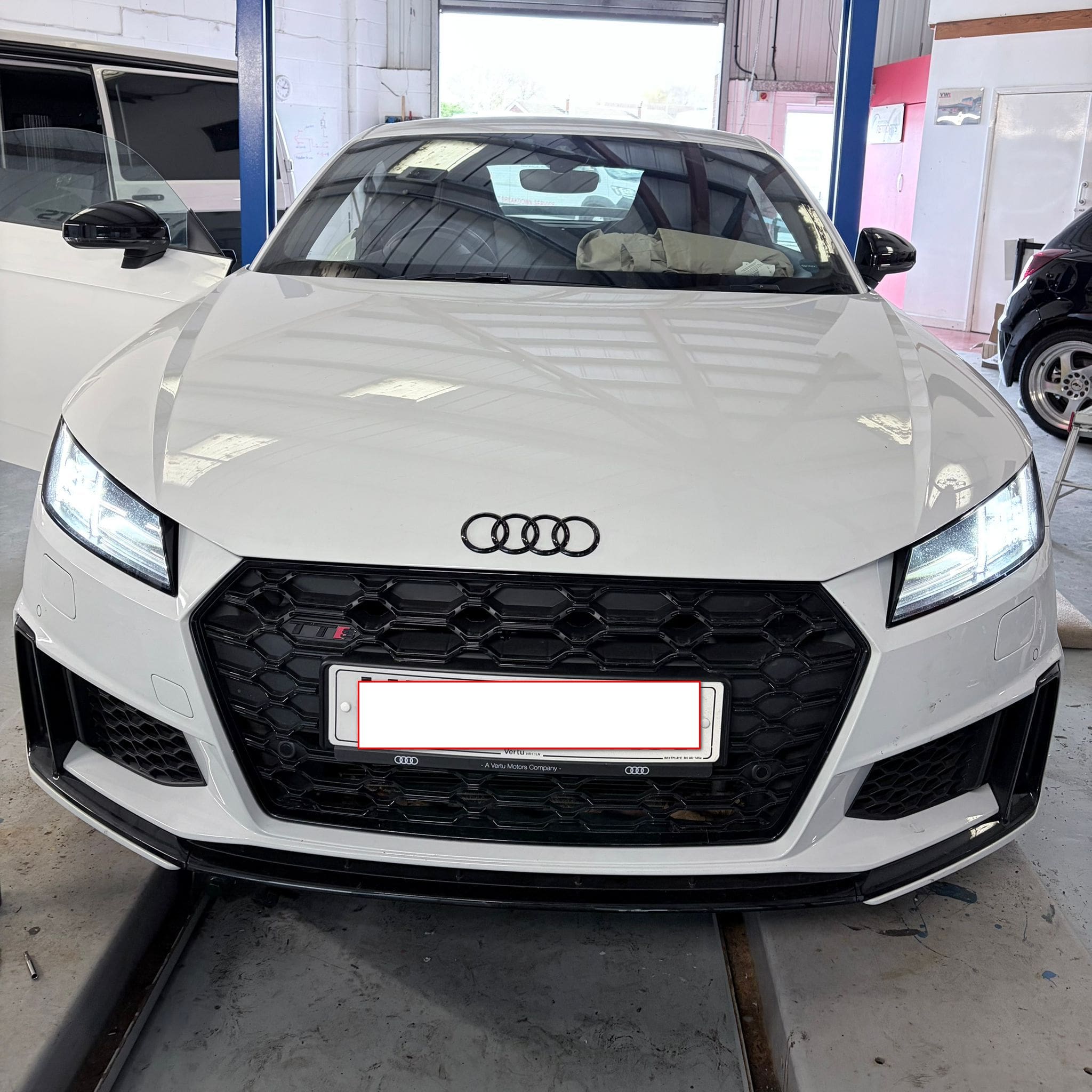Audi TTS Mk2 front bumper close-up after OEM parking sensor retrofit showing clean finished fitment
