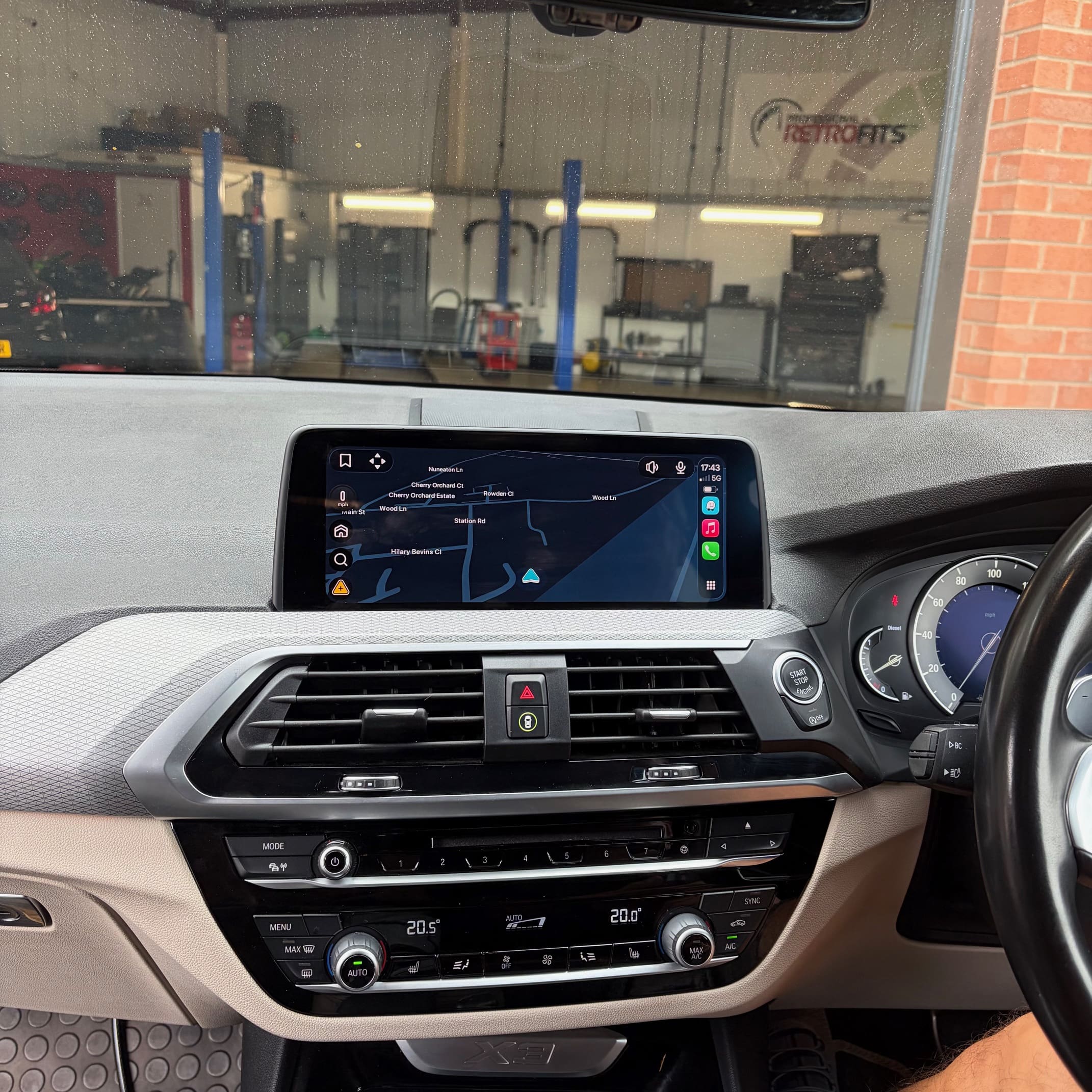 BMW X3 multimedia system upgraded for wireless phone use with factory-like operation