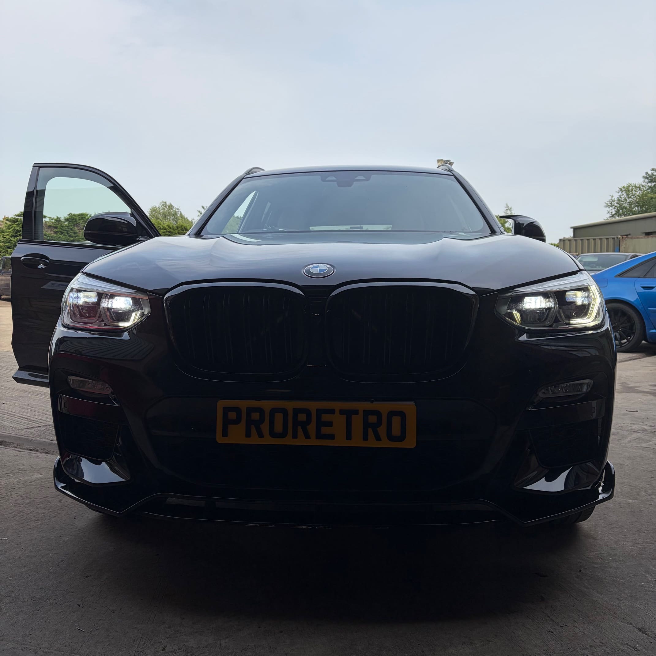BMW X3 in the workshop during App Connect retrofit for wireless phone connection