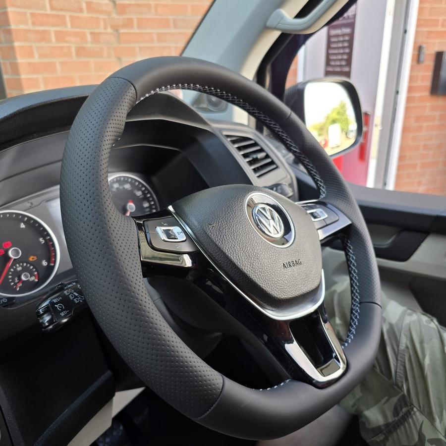Smooth and Perforated Leather Steering Wheel with White Stitching