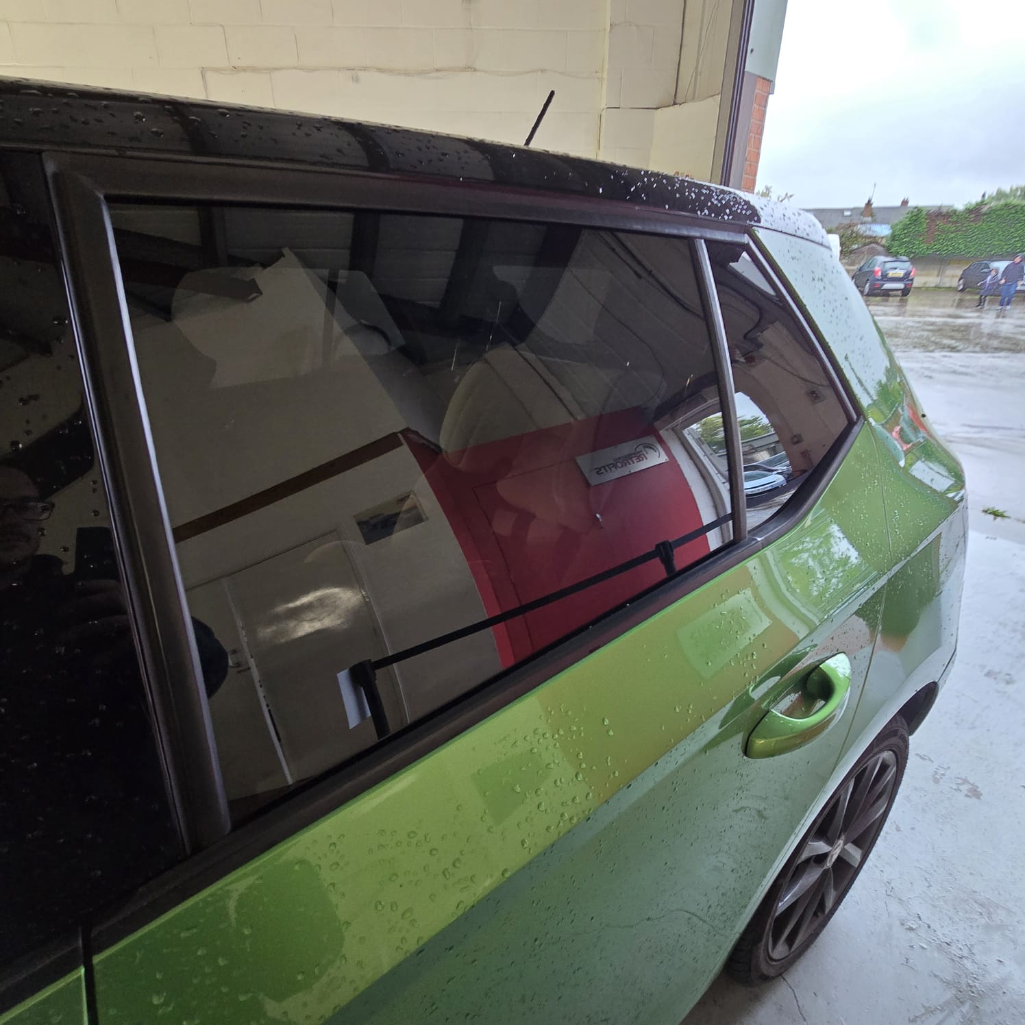 Škoda Fabia rear limo tint with bright green paint