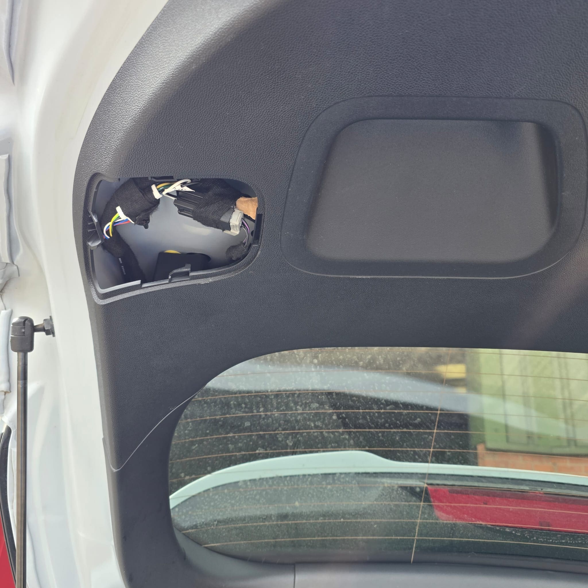 Ford Fiesta ST boot stripped for access to tailgate wiring routes and factory grommets