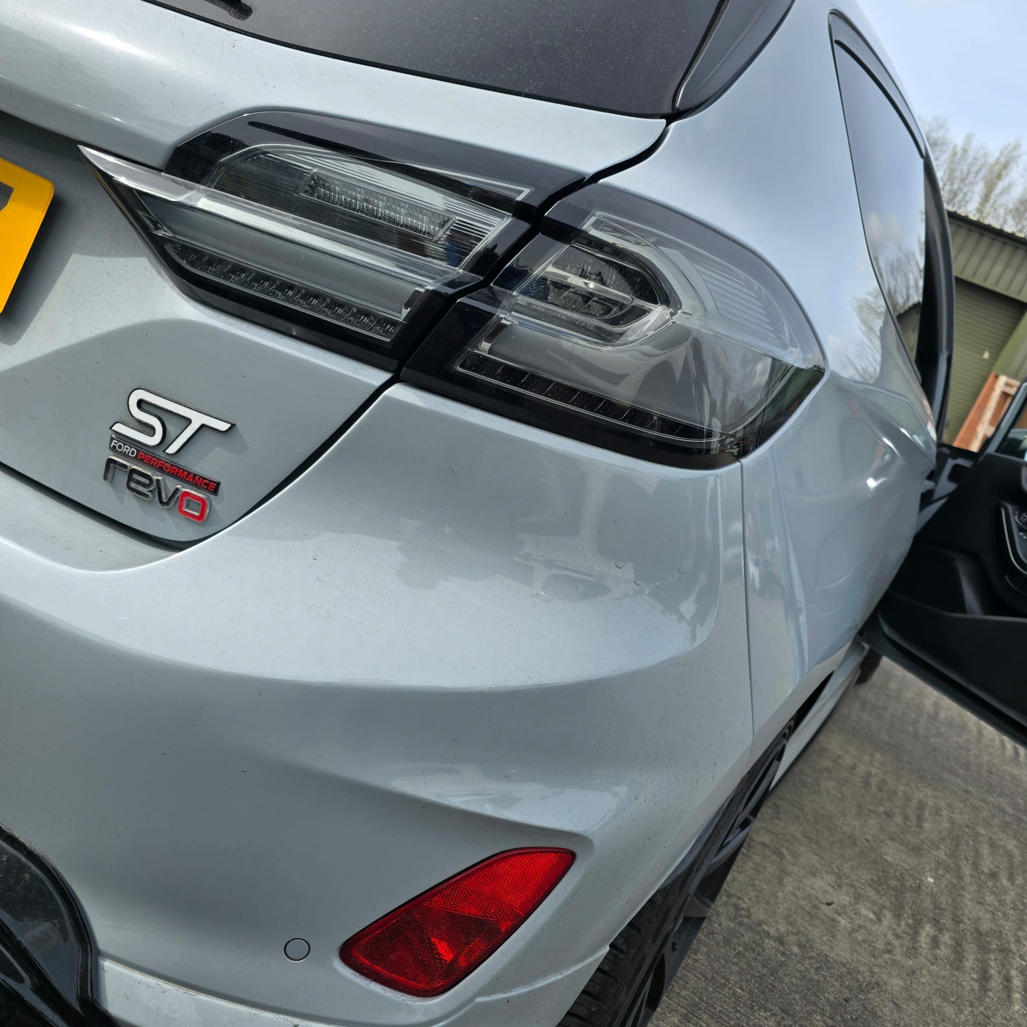 Close-up of protected wiring run following original cable paths for Ford Fiesta ST tailgate light upgrade