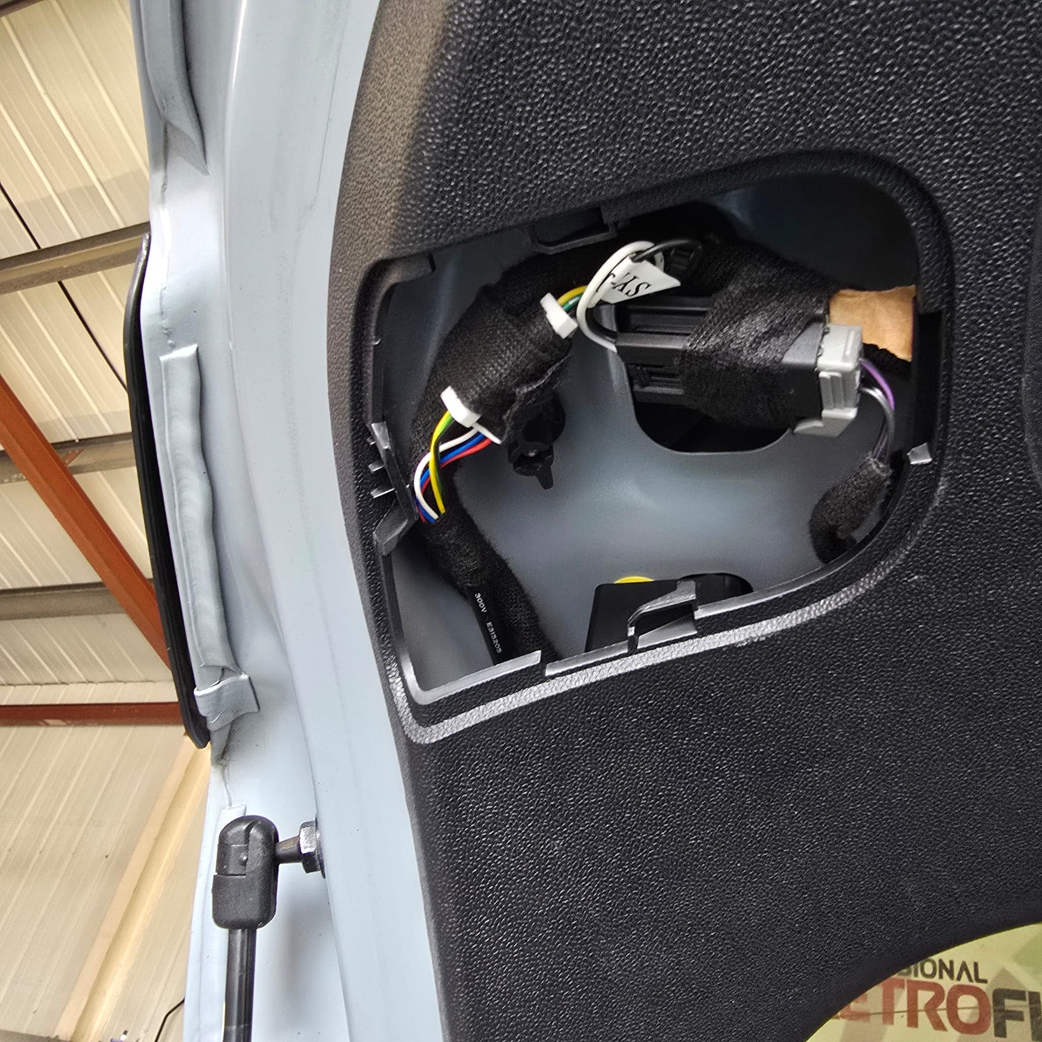 Ford Fiesta ST boot area reassembled after completing tailgate light wiring to OEM standard