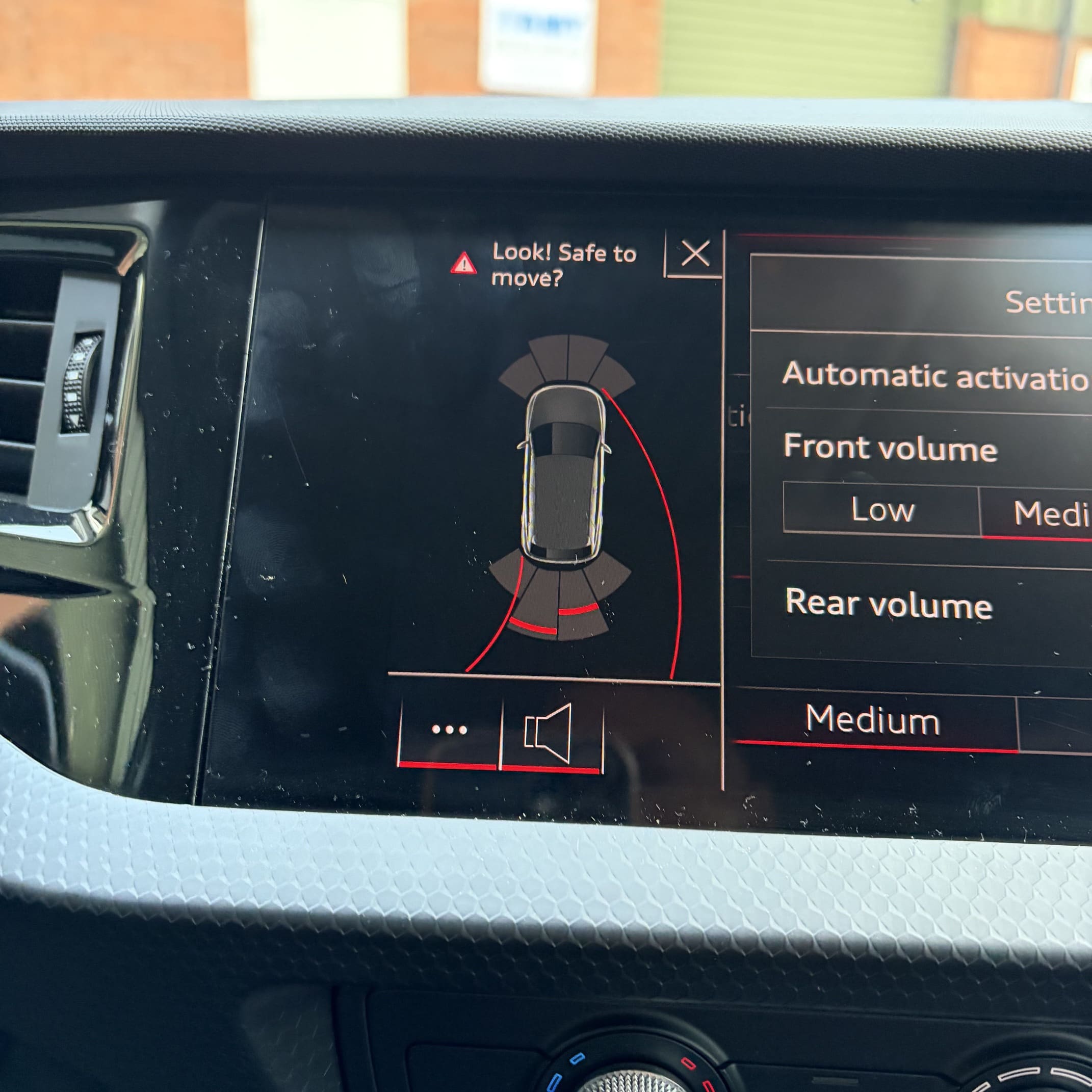 Genuine Audi parking sensor retrofit display shown on the OEM screen in a 2021 Audi A1