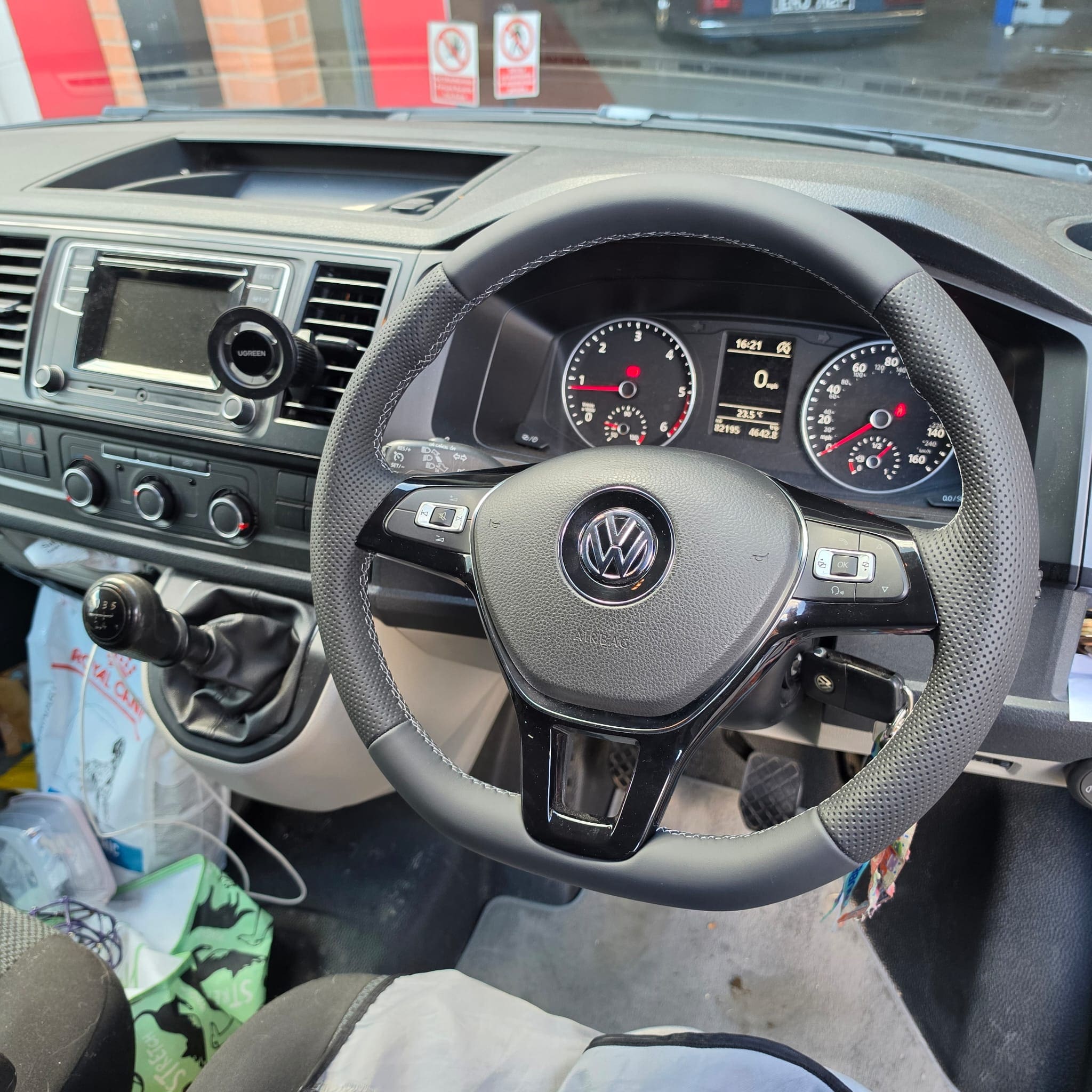 Detailed view of hidden leather joins on a retrimmed Volkswagen steering wheel