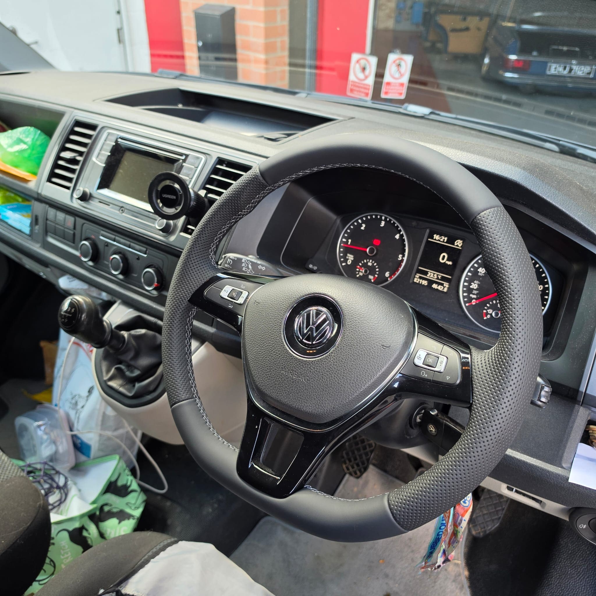 Close view of a retrimmed Volkswagen steering wheel showing smooth leather joins