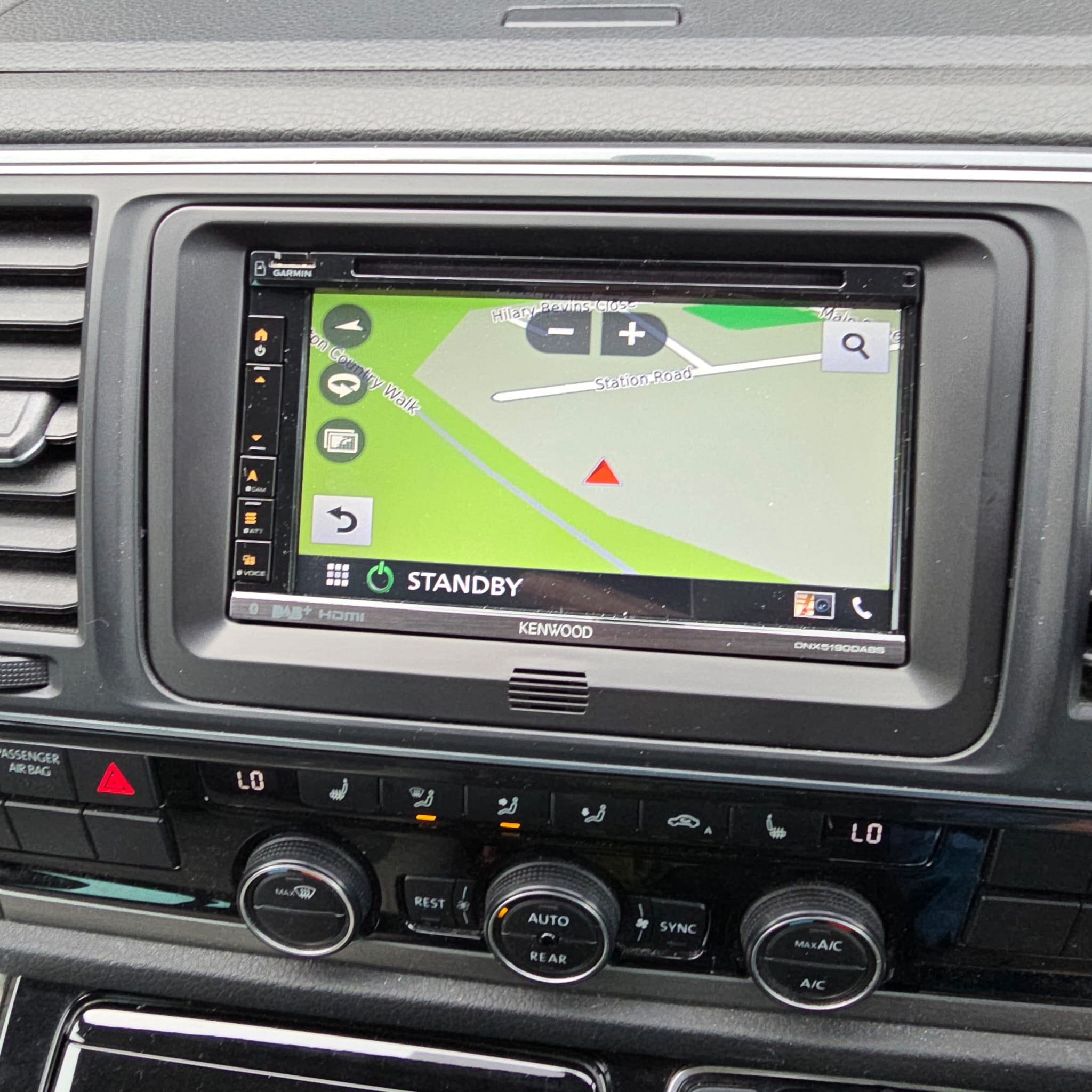 Volkswagen Transporter T6 center console with Kenwood DNX5190DABS installed and powered on