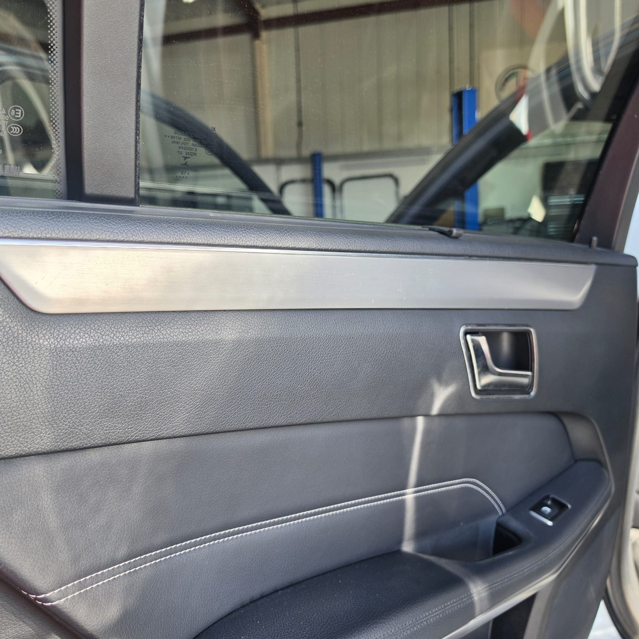 Mercedes E-Class dashboard trim sections refitted after mounting frame transfer