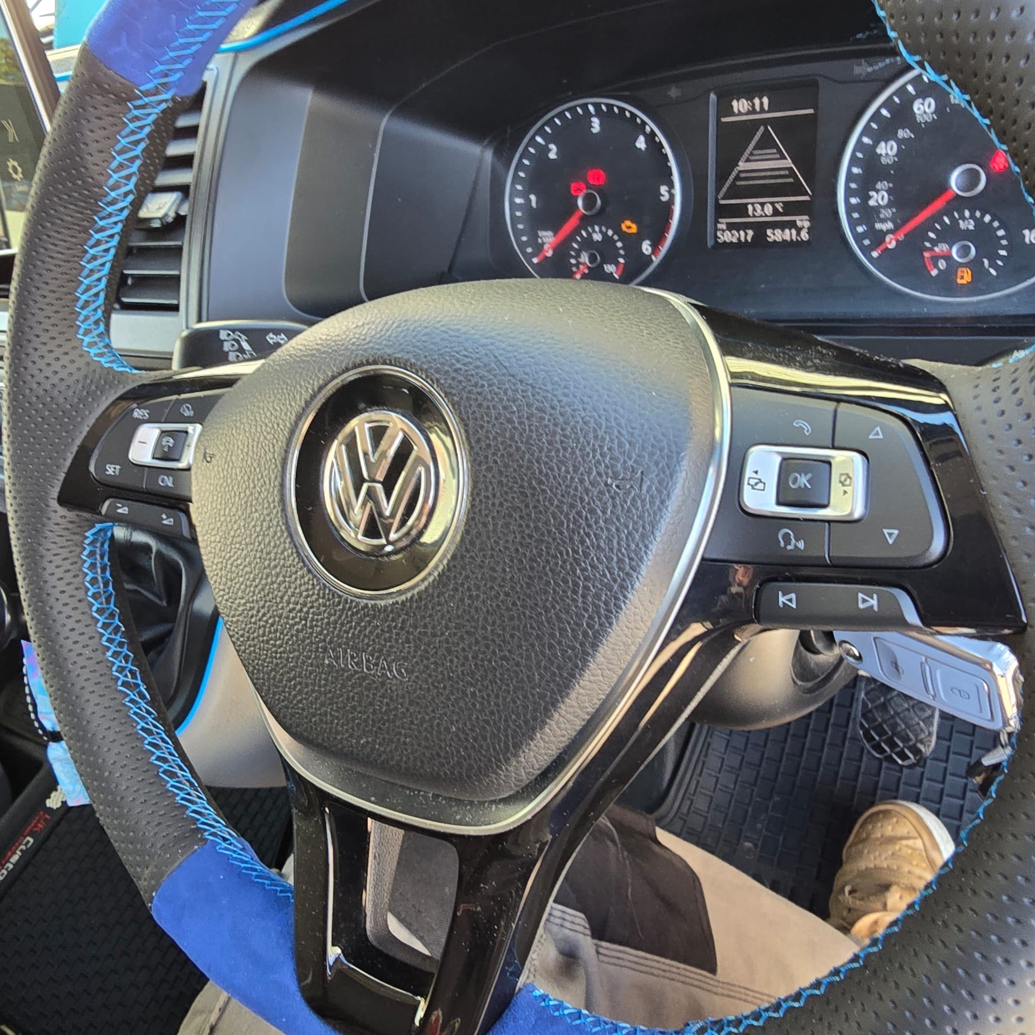 Workshop view of VW Transporter during adaptive cruise control retrofit configuration