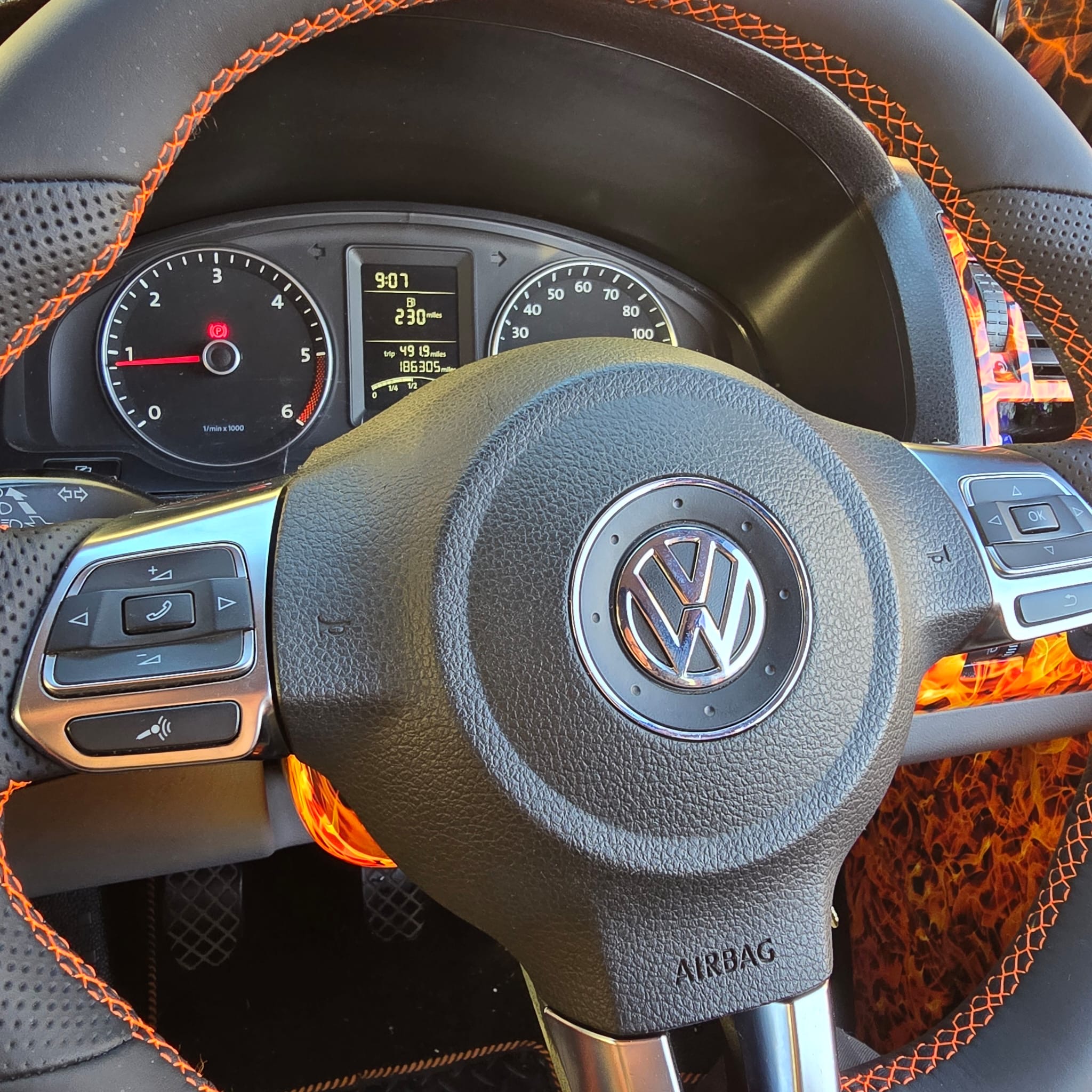 Close-up of MK6 Golf steering wheel with Nappa leather orange stitching