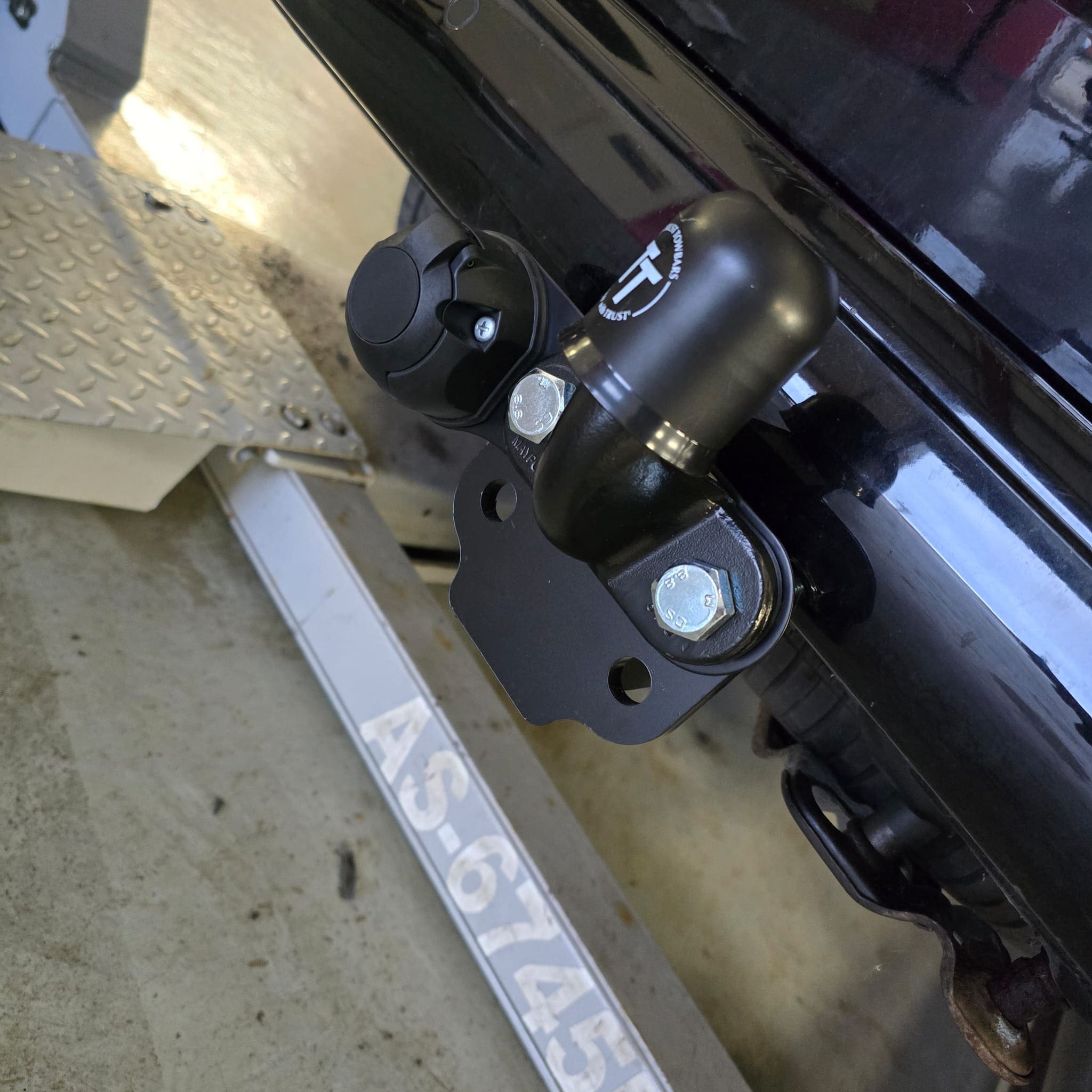Completed flange towbar installation showing the towbar assembly and mounting points