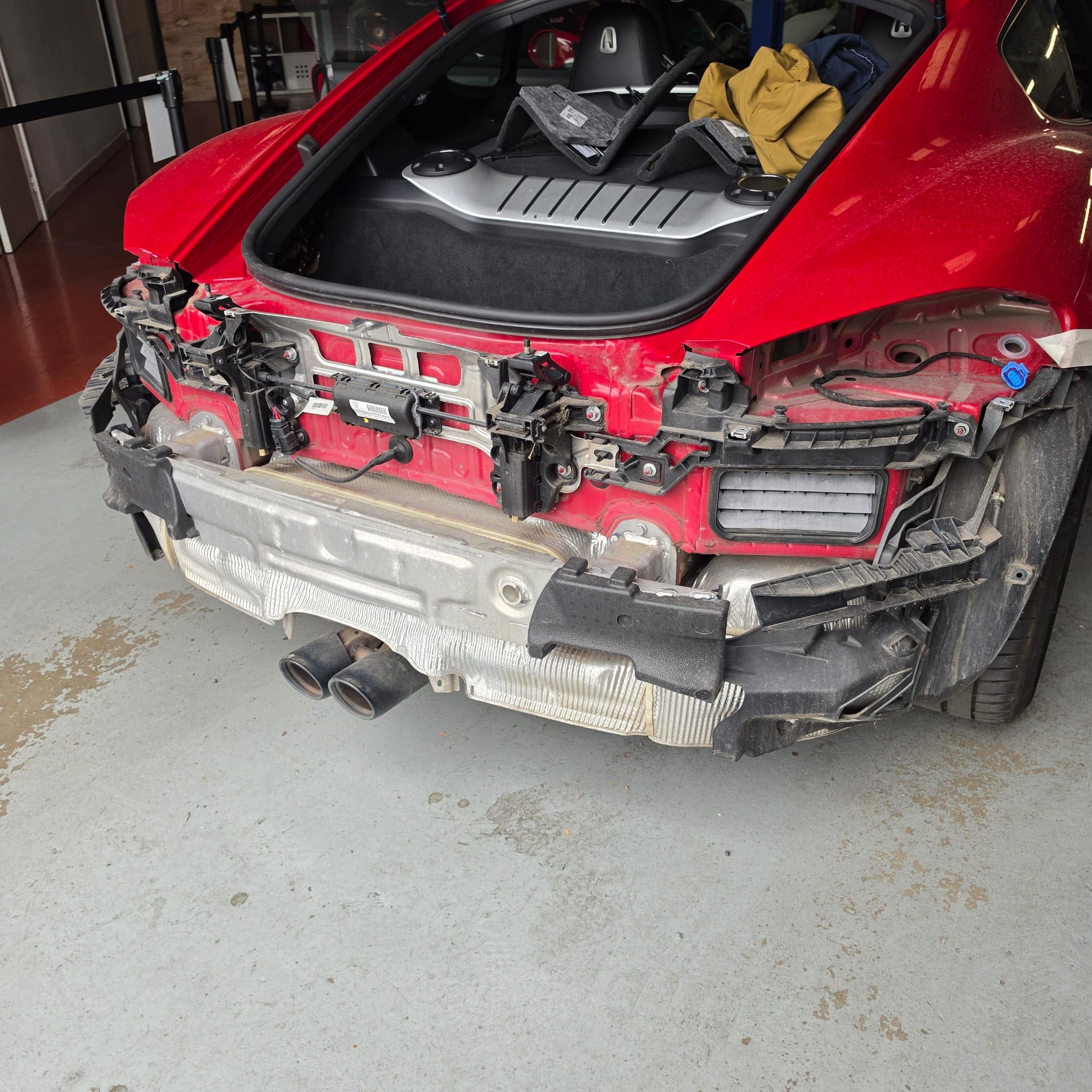 Porsche 718 Cayman stripped down for rear camera and wiring access