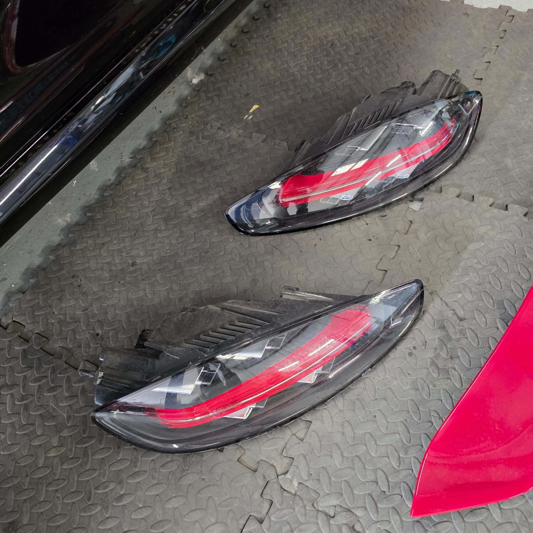 Strip-down work underway on a Porsche 718 Cayman for rear camera installation