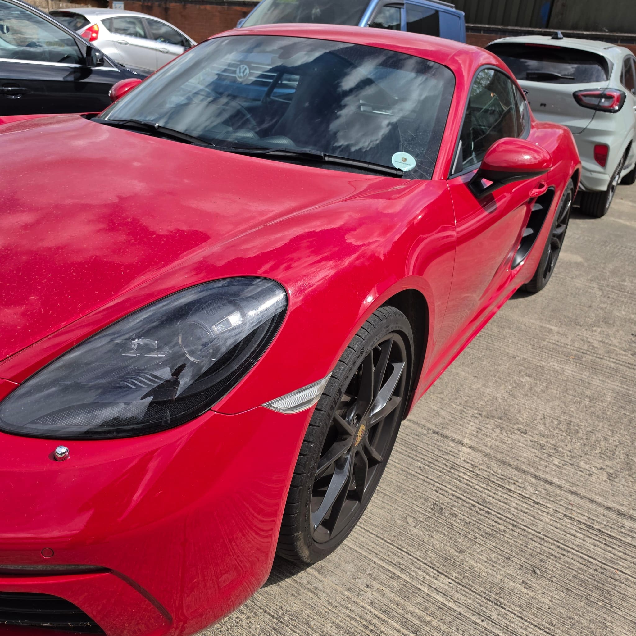 Completed Porsche 718 Cayman rear camera retrofit operating through the original stereo