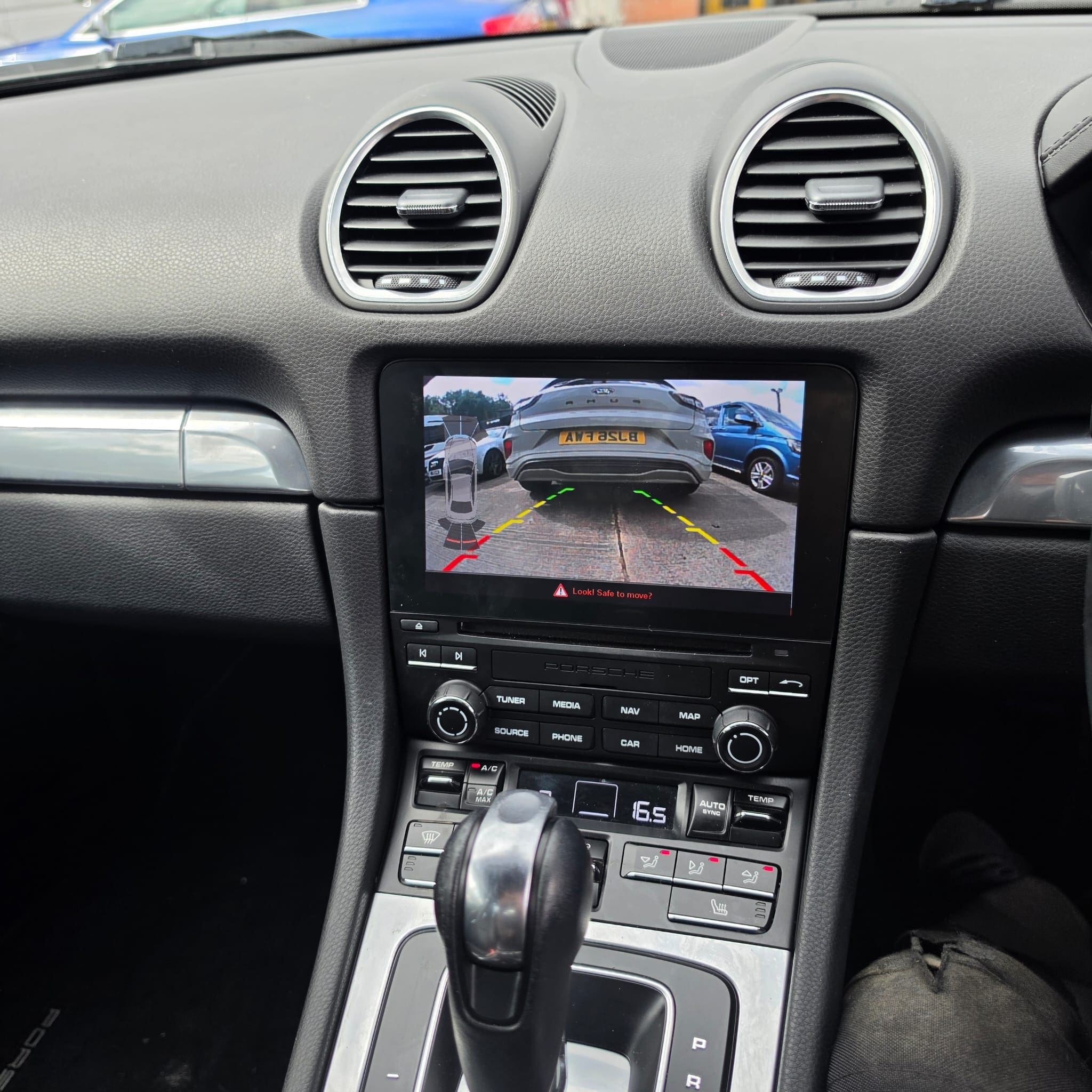 Porsche 718 Cayman interior and trim removed during rear camera retrofit work