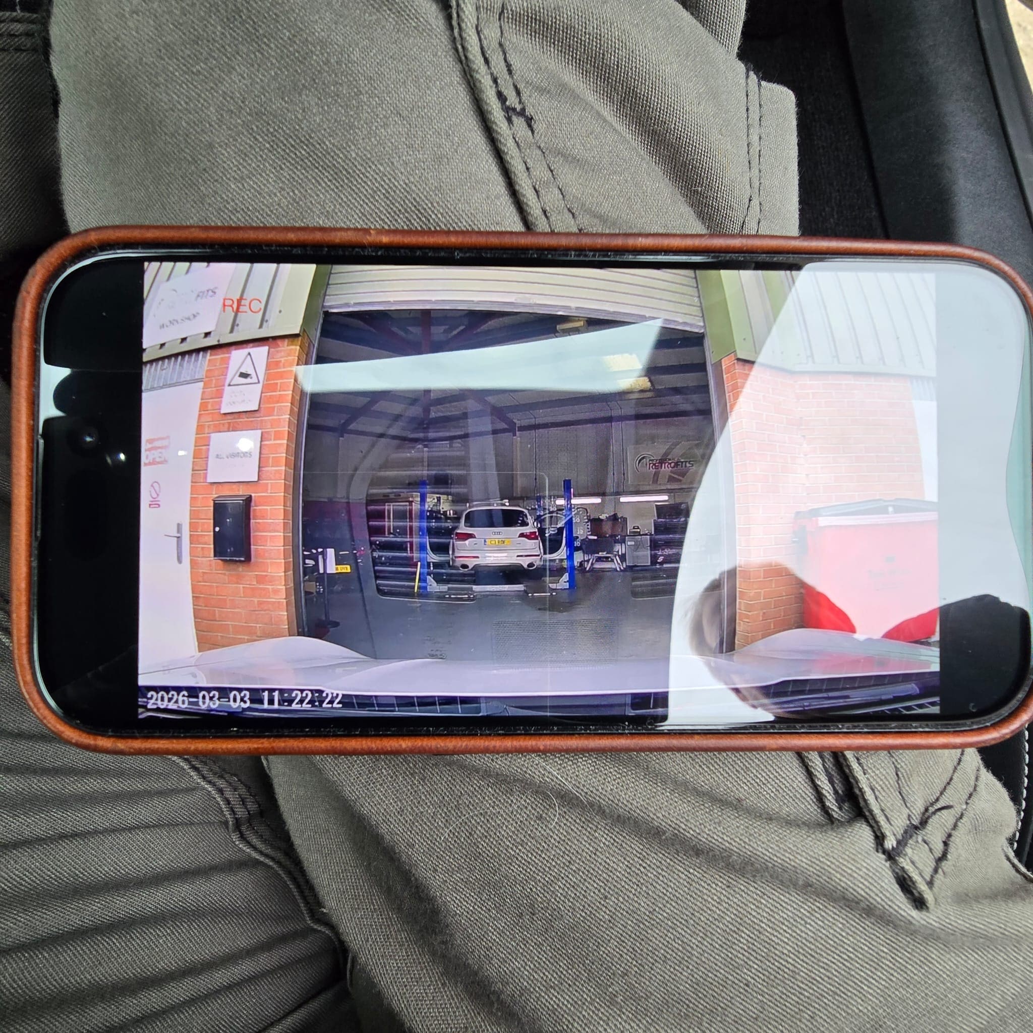 Detailed view of the mirror trim integration for the vehicle-specific dash cam in a Porsche 911