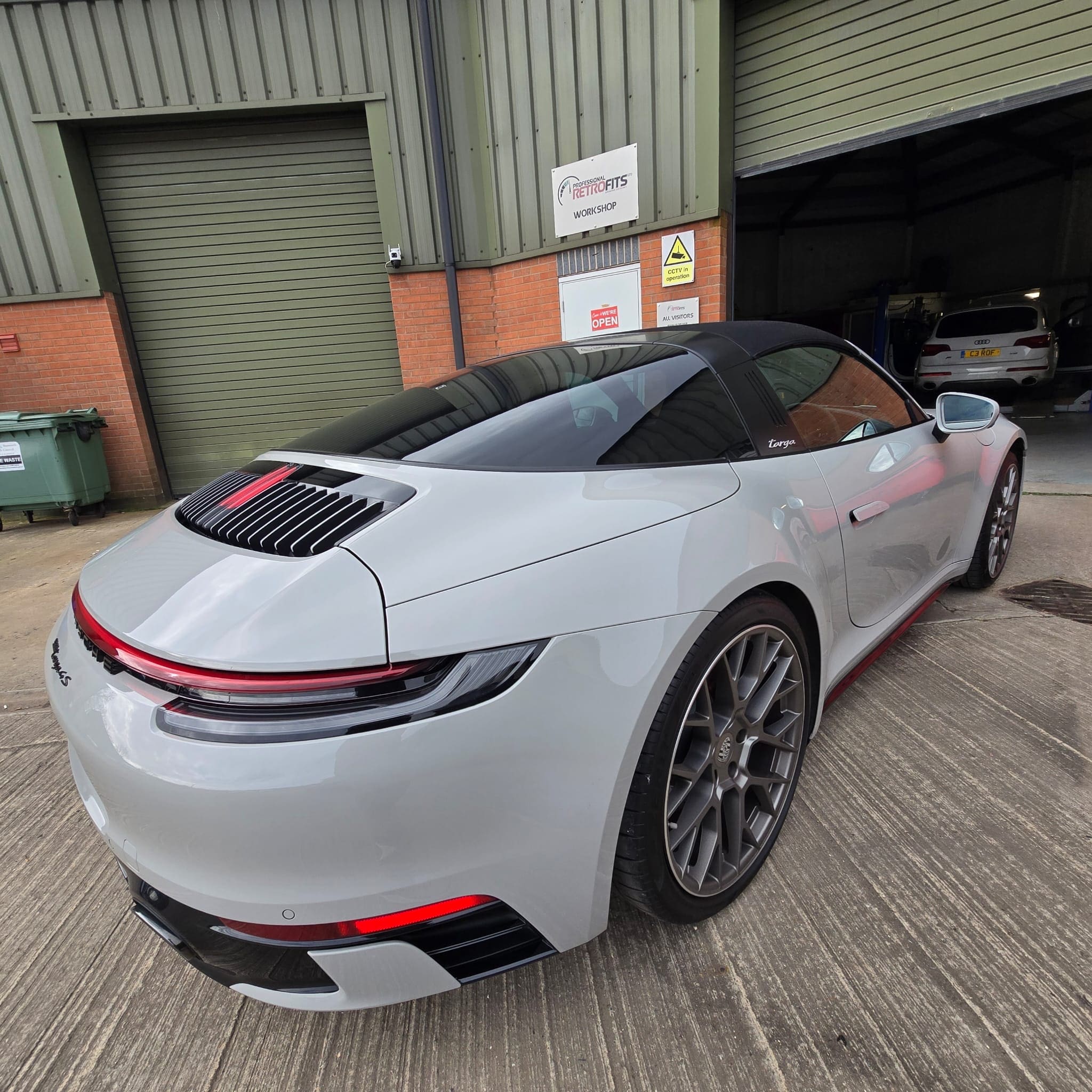 Finished OEM-style dash cam retrofit in Porsche 911 with no visible add-on mount