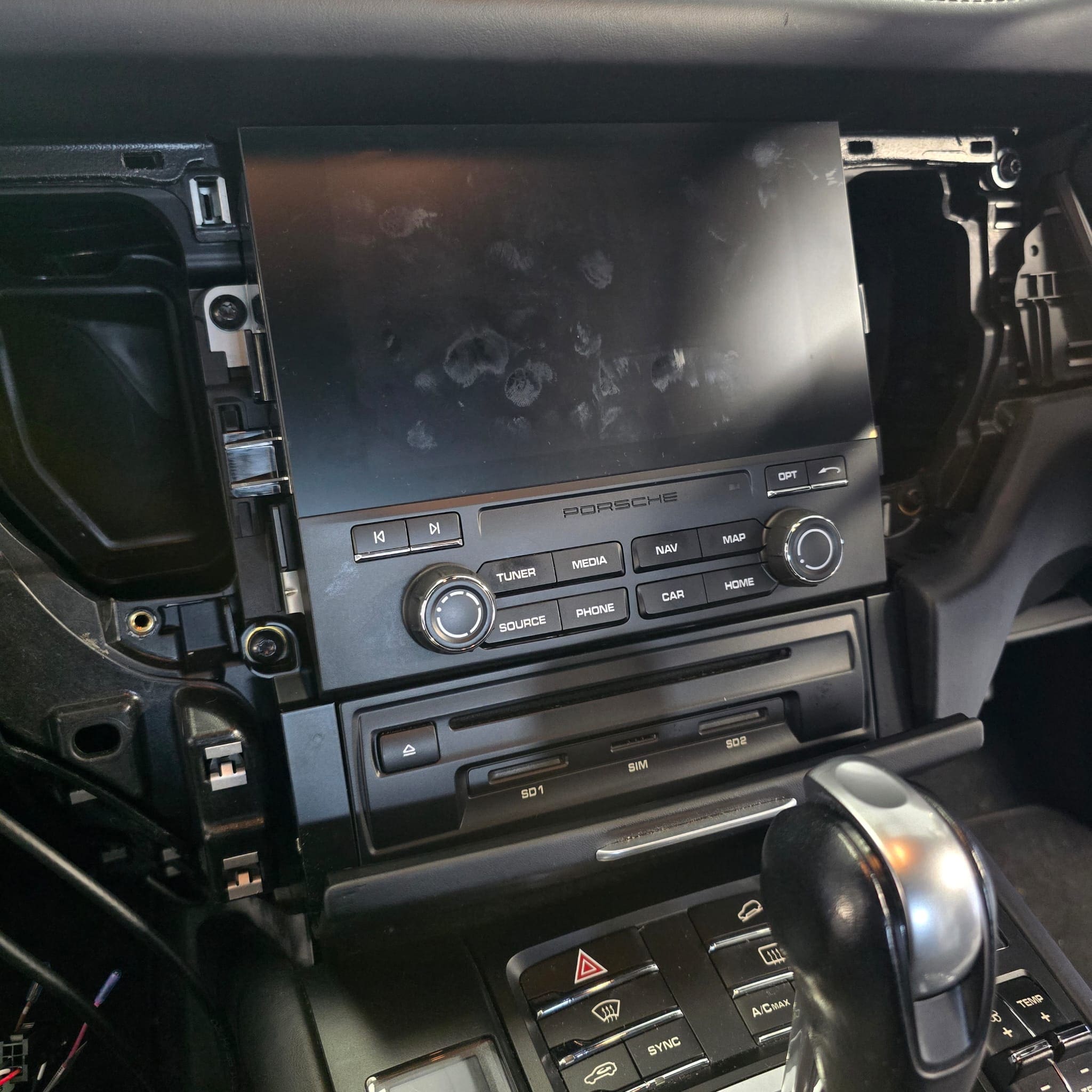 Completed Porsche Macan CarPlay retrofit with a clean interior and hidden installation