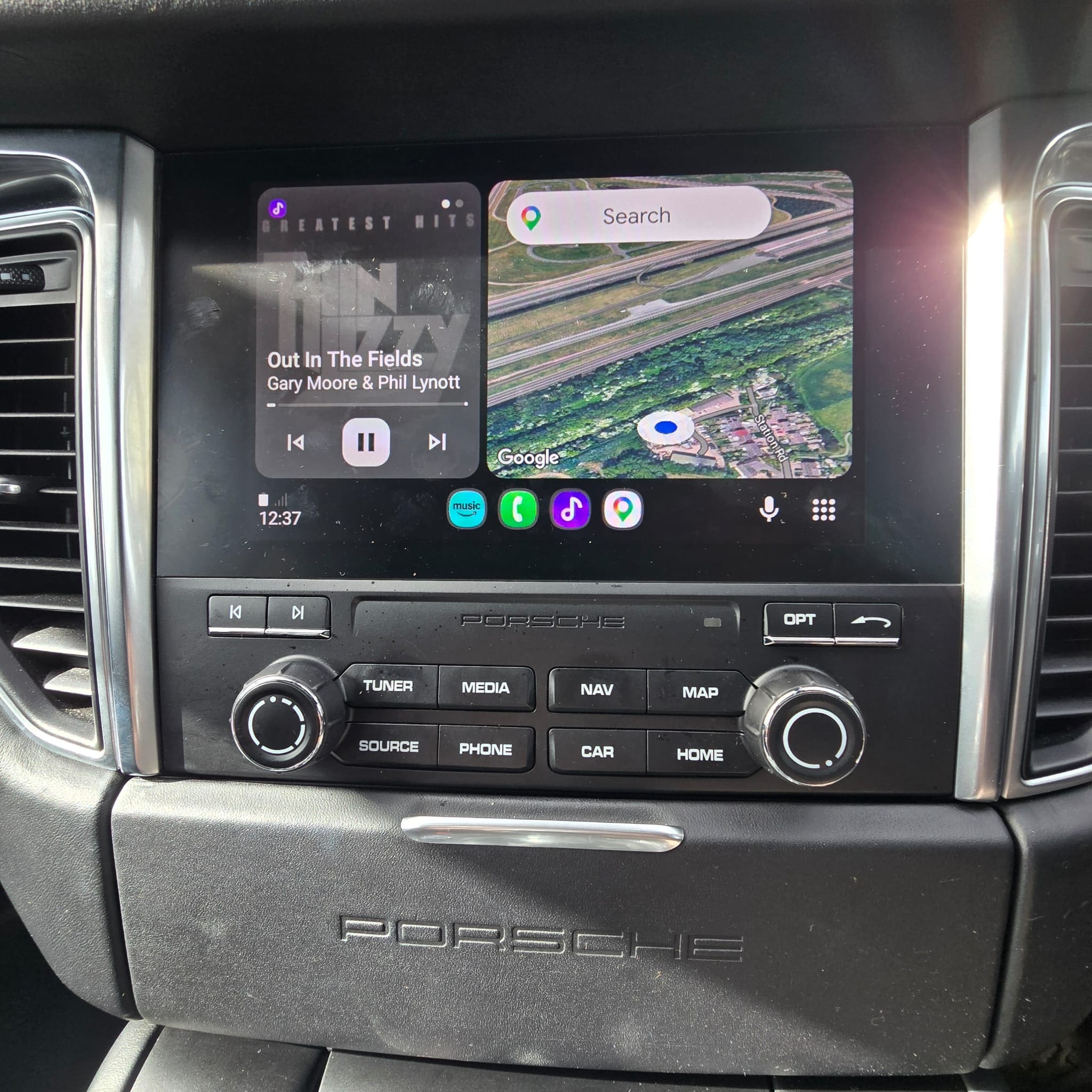 Porsche Macan glovebox area showing the concealed location used for the CarPlay integration
