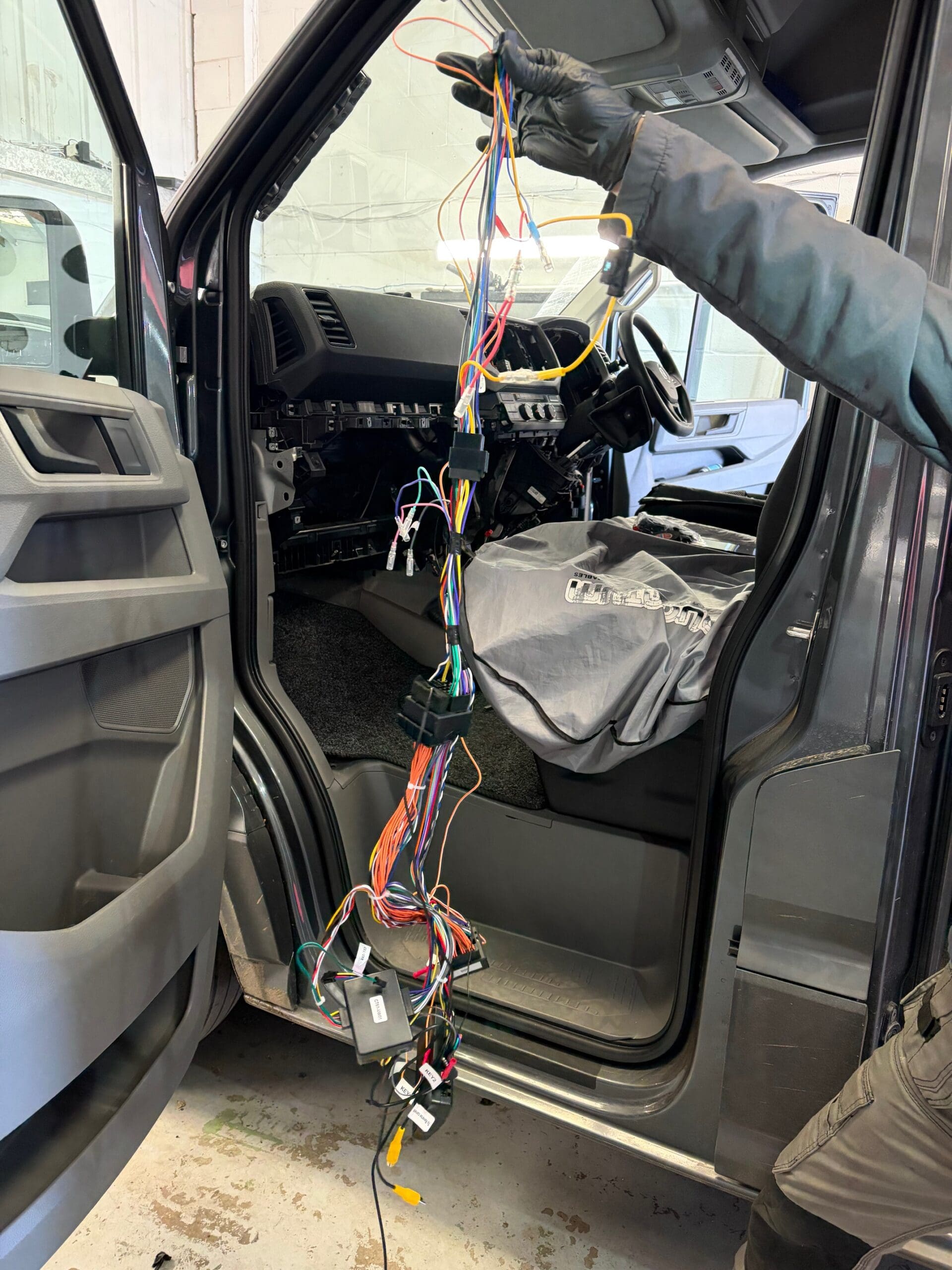 VW Crafter interior partially disassembled to allow neat routing for an Alpine Halo 9 install