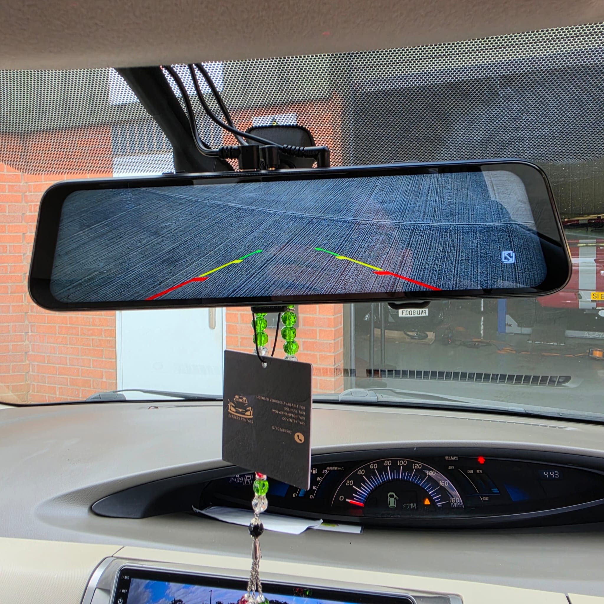 Interior wiring and front dashcam cable routing during Toyota Estima retrofit