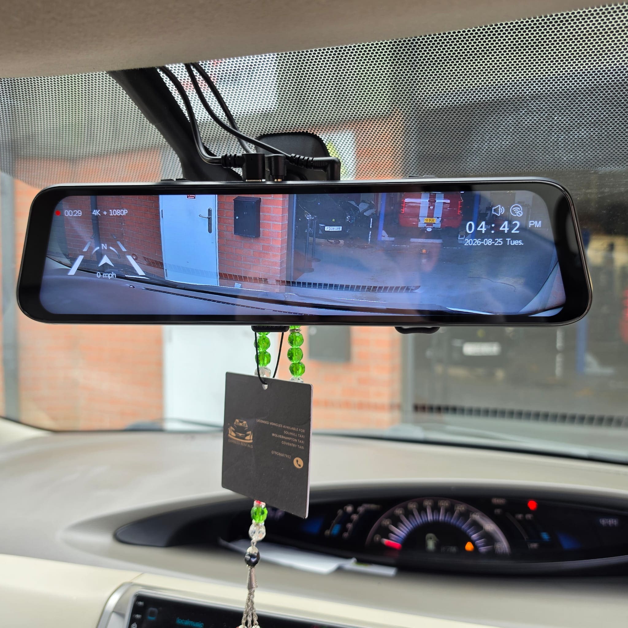 Completed Toyota Estima retrofit with Wolfbox mirror and camera wiring routed neatly