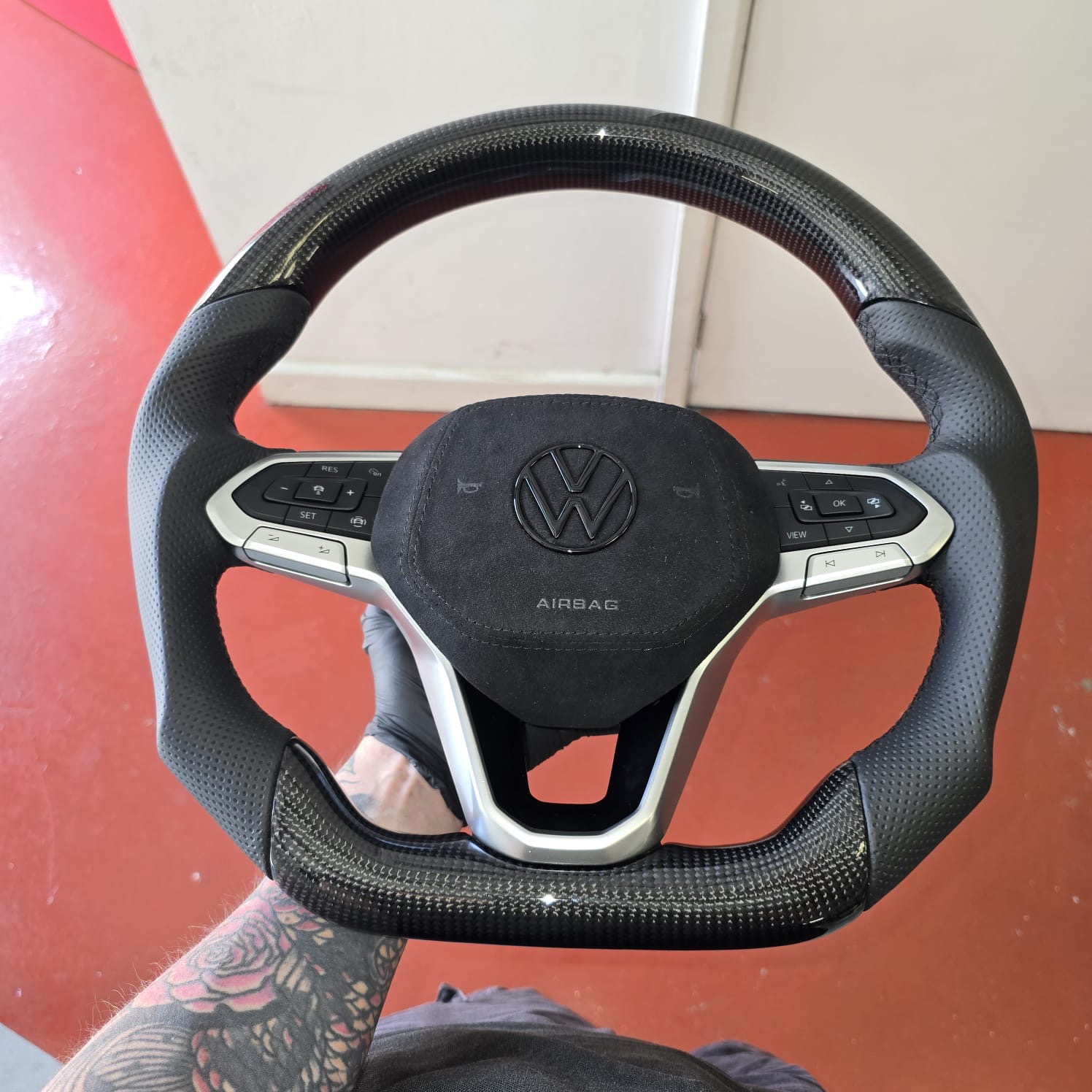 VW T6.1 carbon fibre and Alcantara steering wheel close-up
