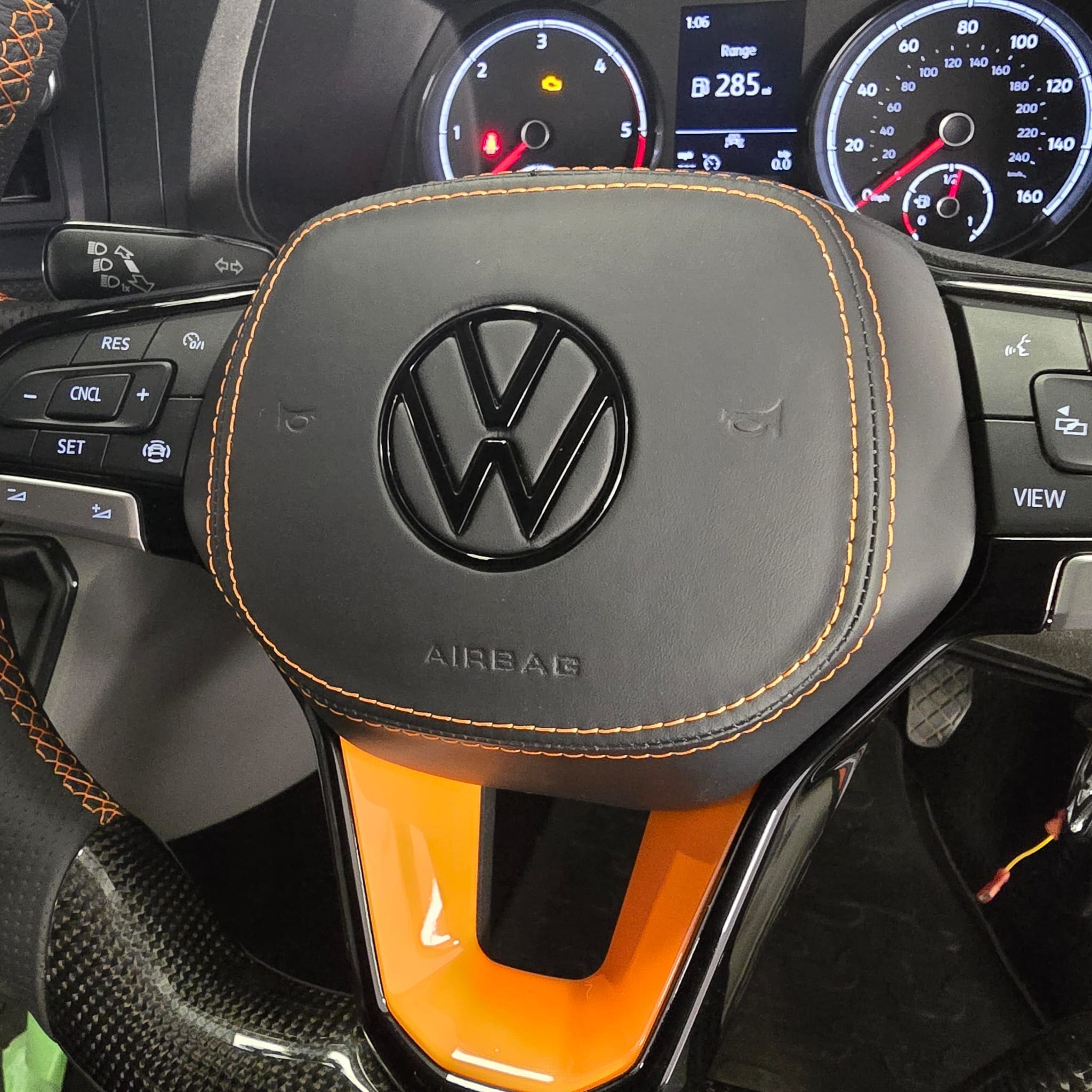 Carbon fibre airbag cover overlay installed for a clean OEM-style finish