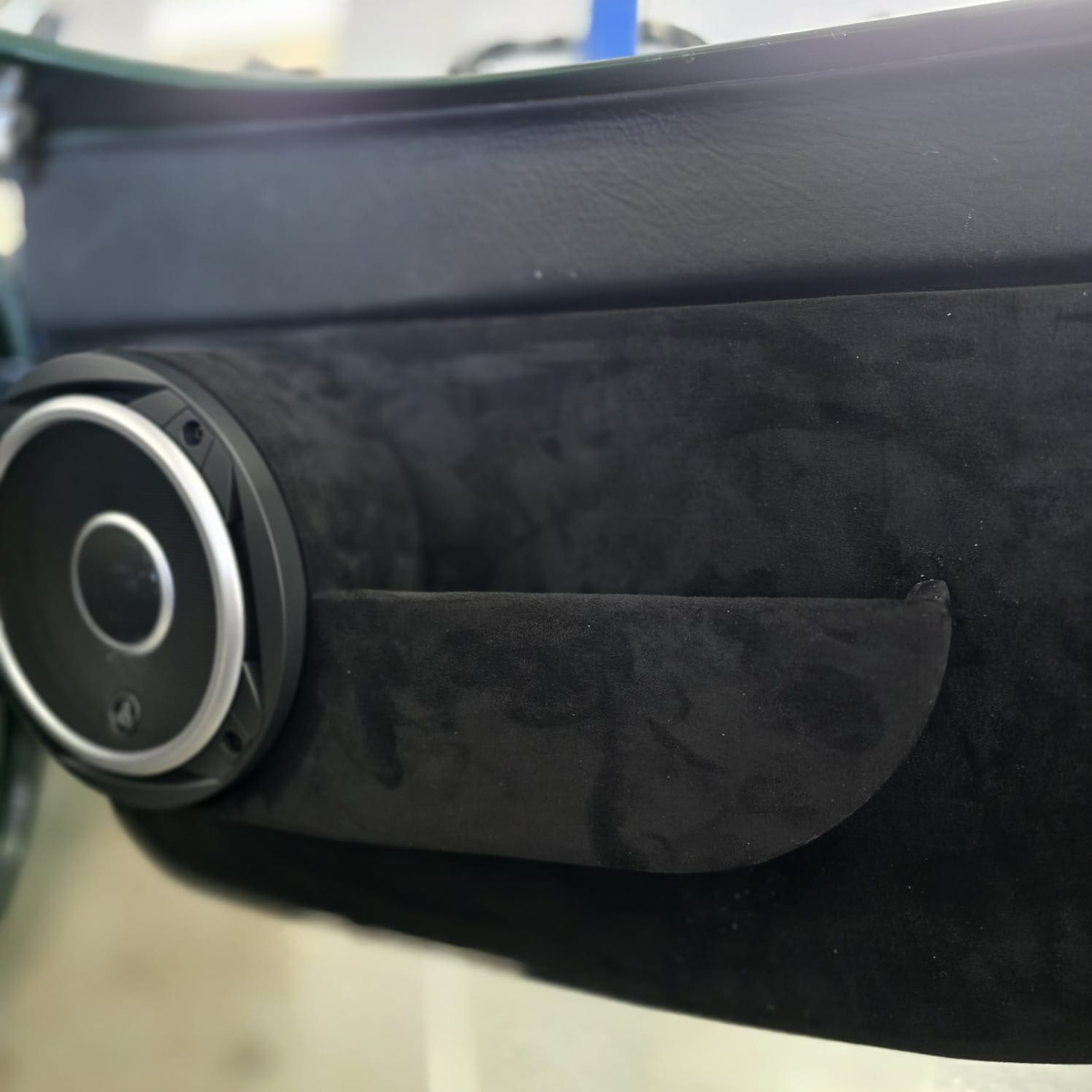 Soft-touch carpet and Alcantara trimmed door pockets