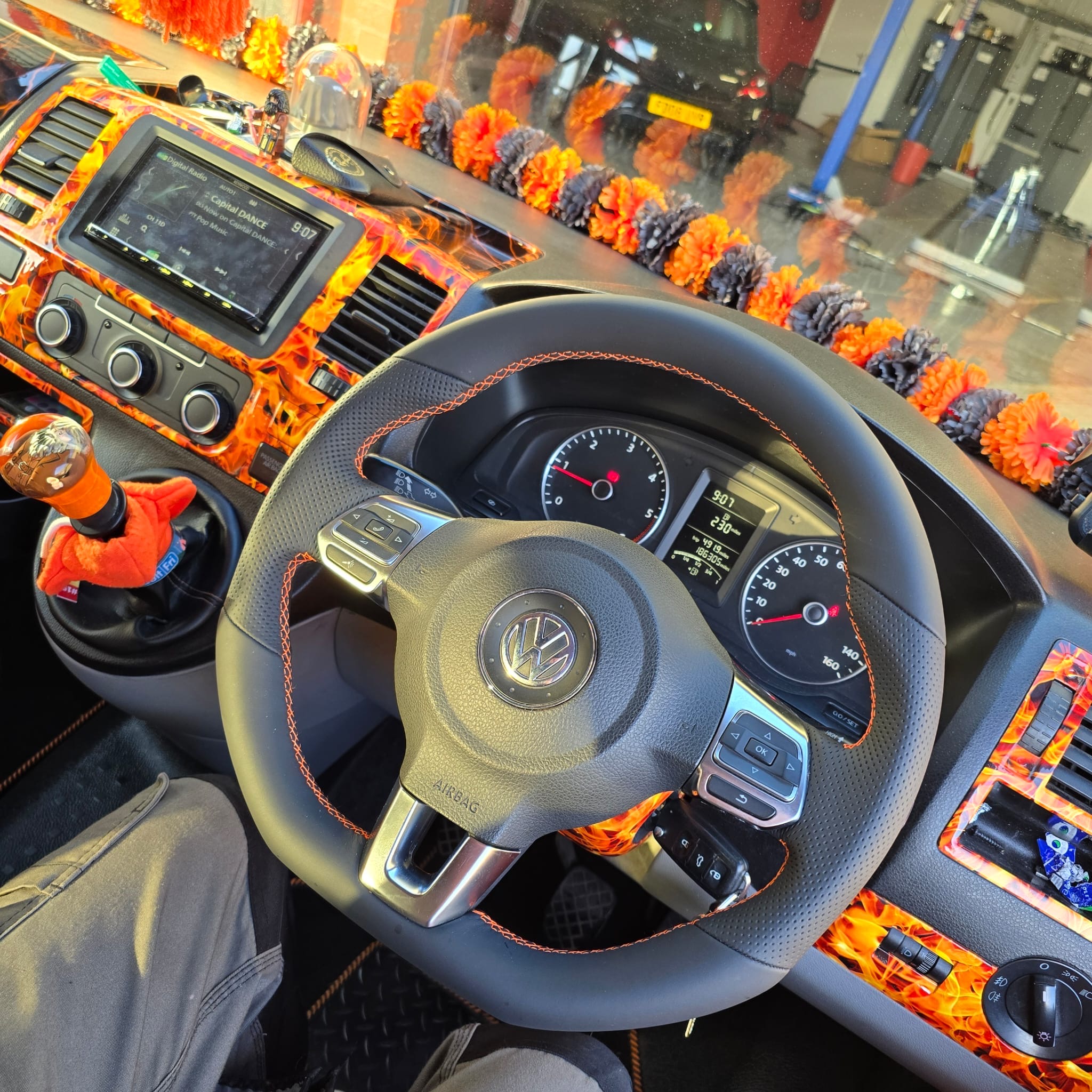 Custom MK6 Golf steering wheel retrimmed in orange stitched Nappa