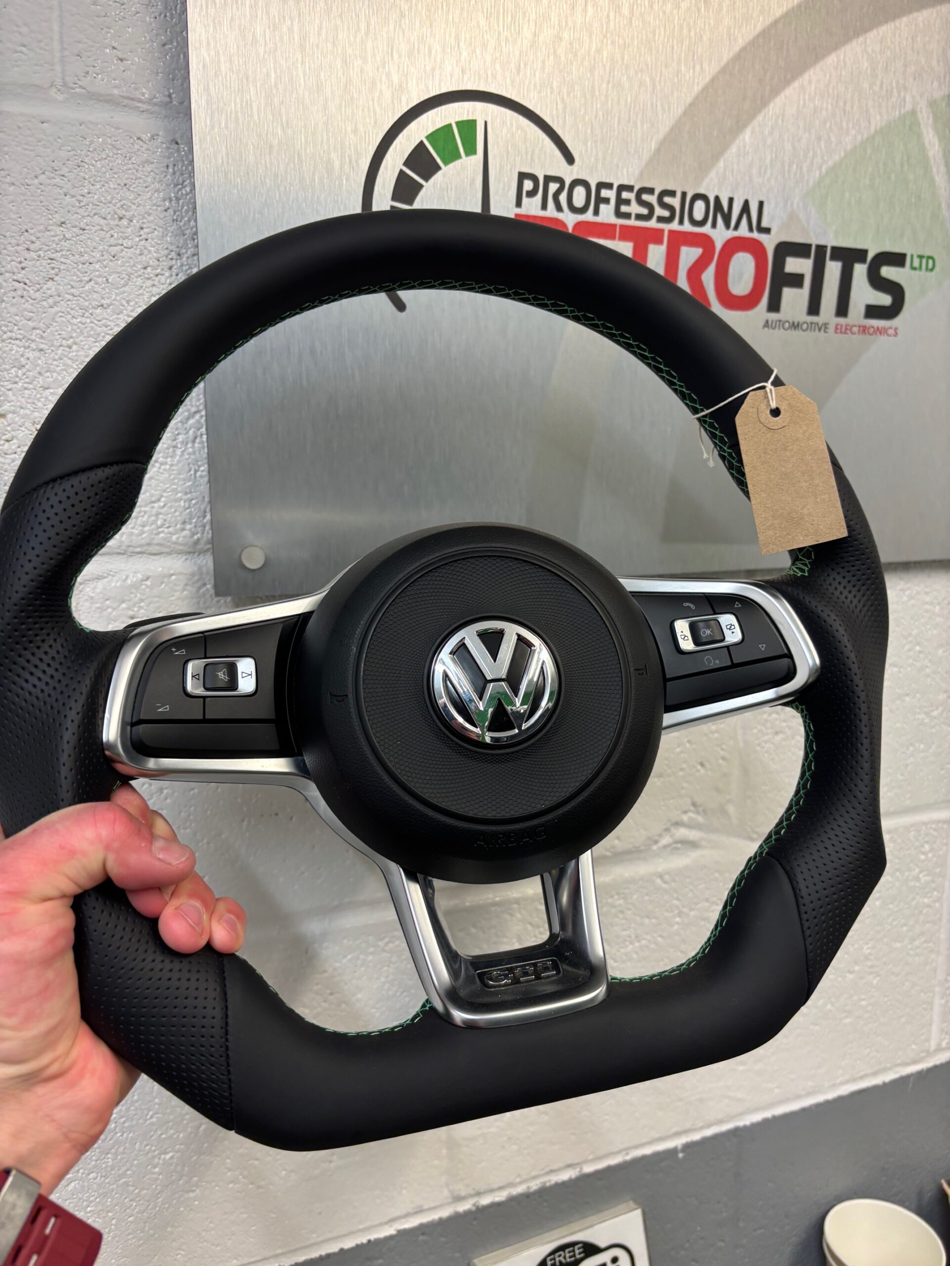 Golf MK7 BadBoy steering wheel with UK-made retrim and green stitching