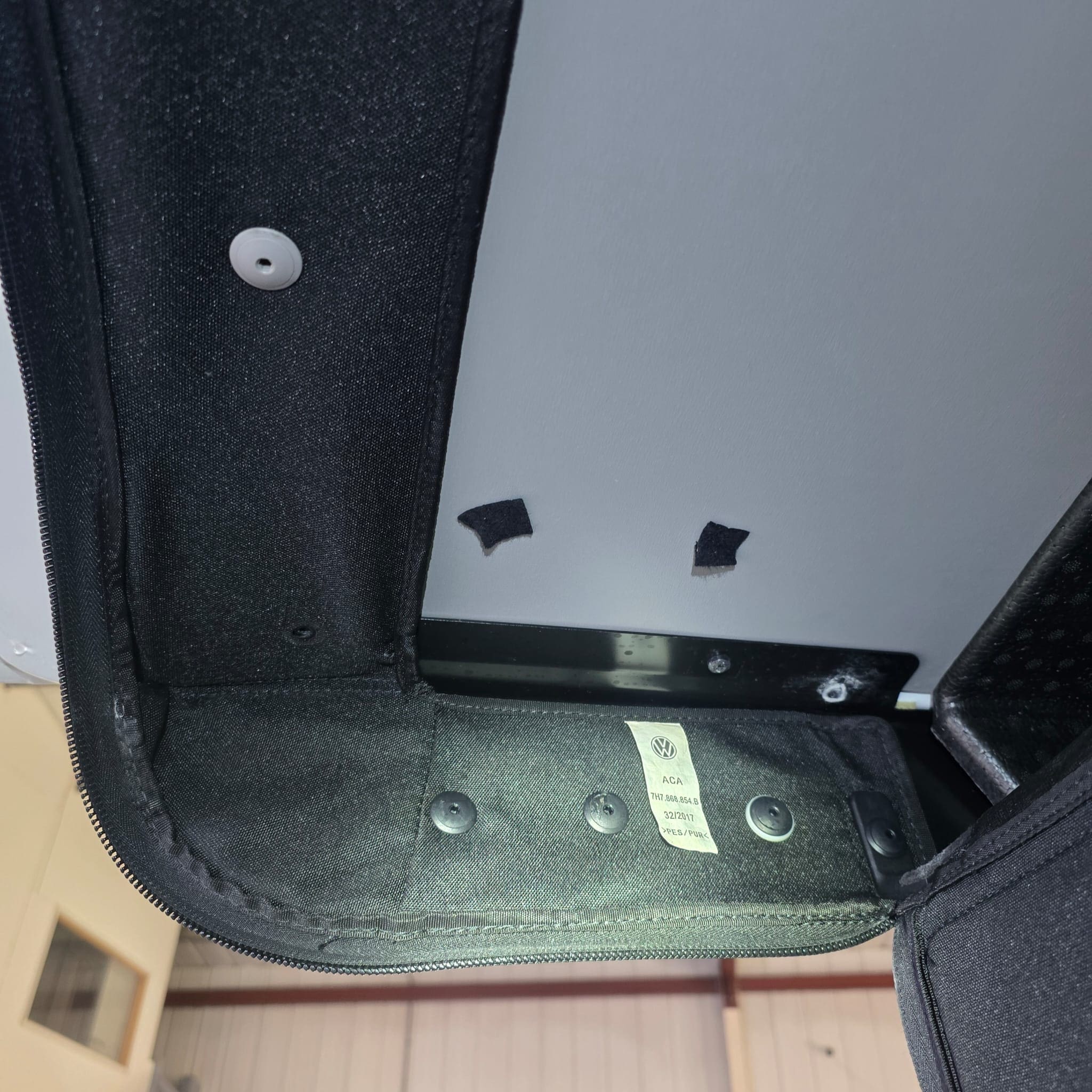 Damage from previous rear camera install found behind Volkswagen California tailgate trim
