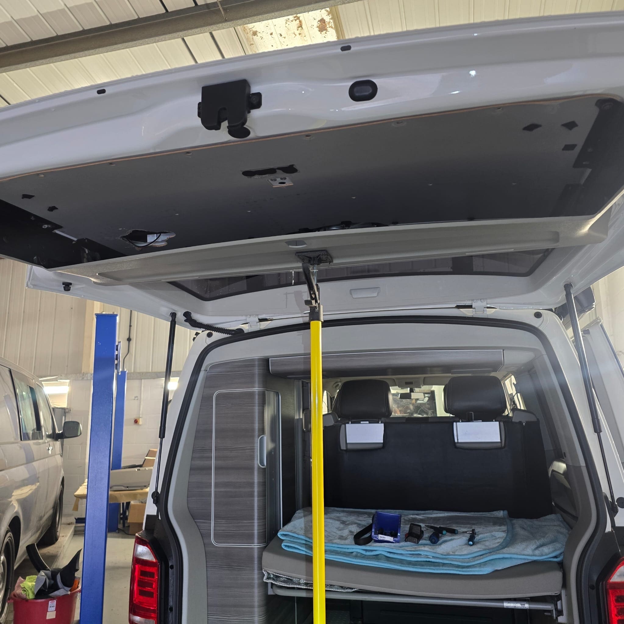 Volkswagen California tailgate stripped around the camping chair holder to access camera wiring properly