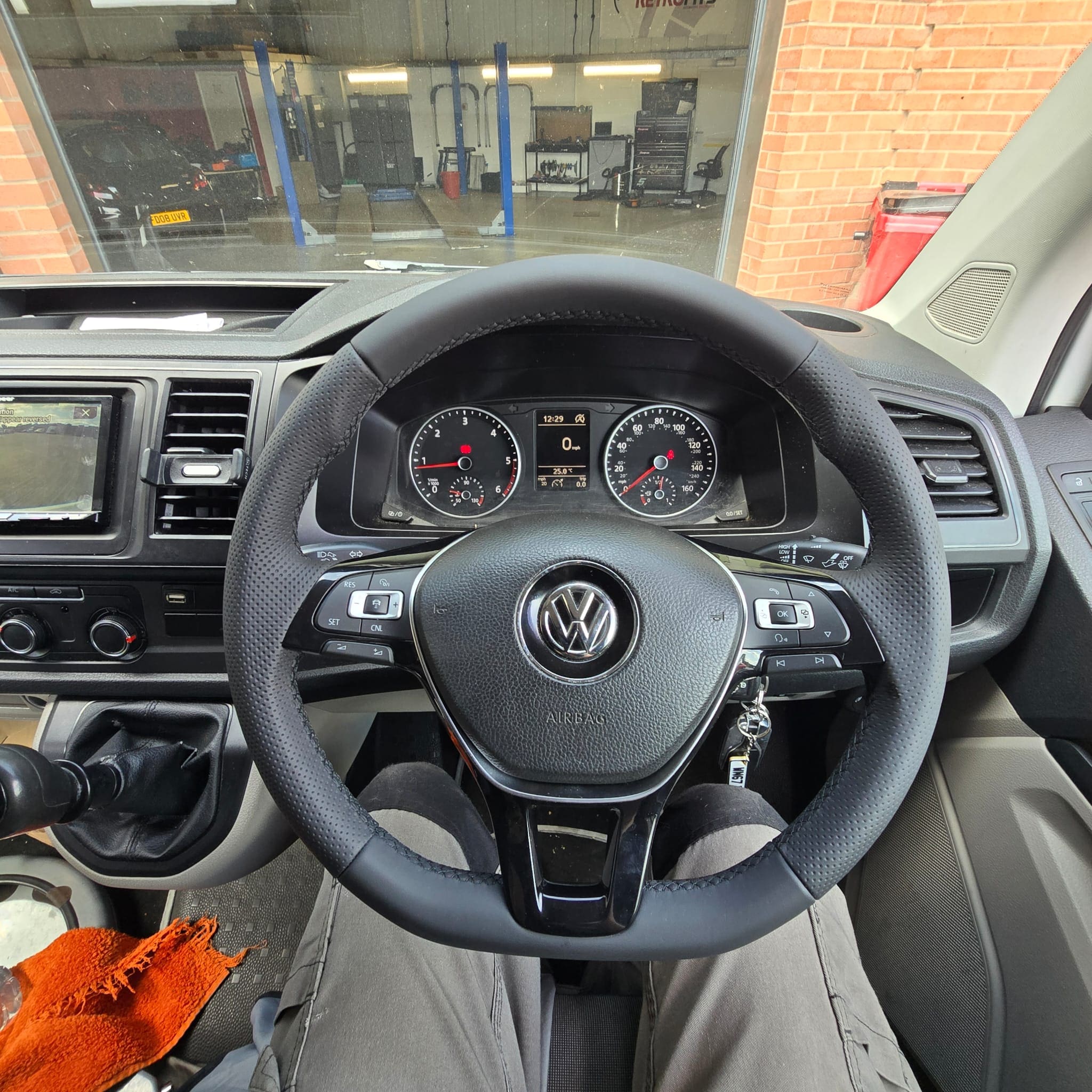 Volkswagen Transporter T6 steering wheel retrim showing perforated leather sides and smooth leather top and bottom